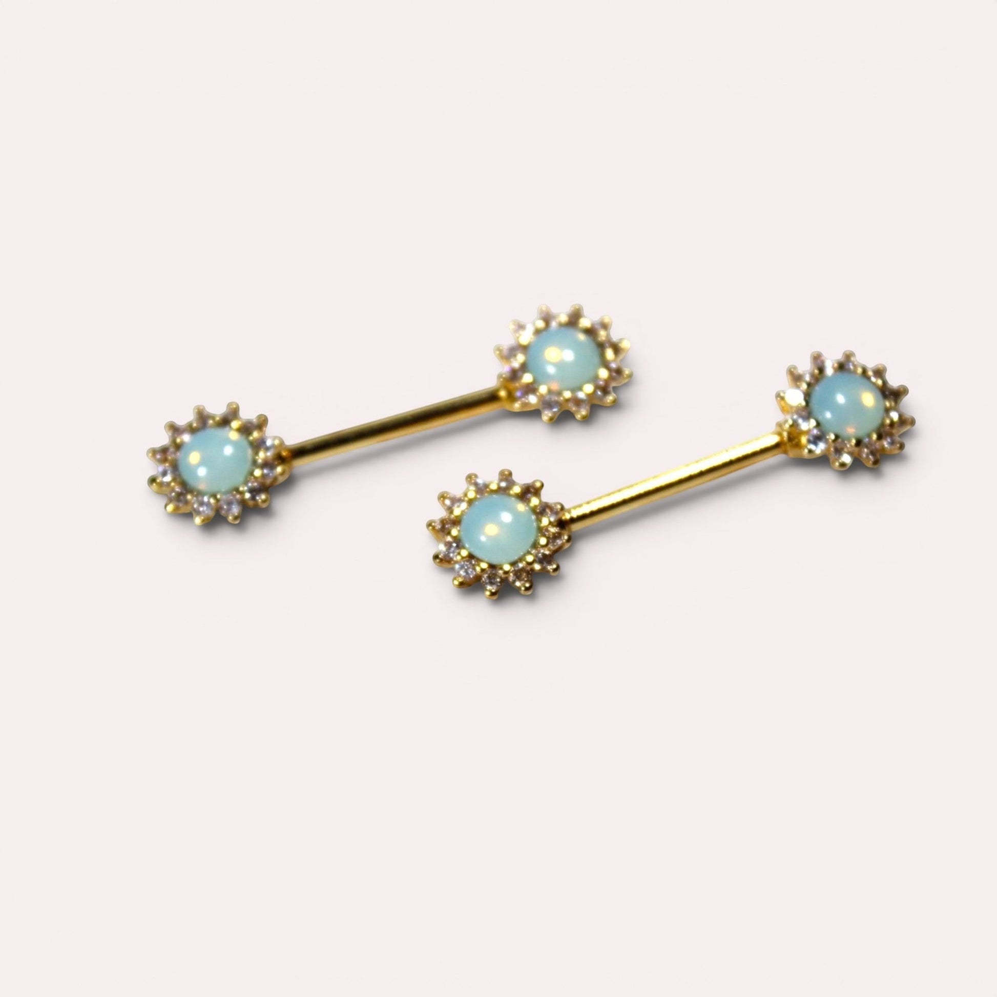 MKBodyJewelry gold 14g nipple barbell set of 2 with green opal sun ends and clear CZ accents.