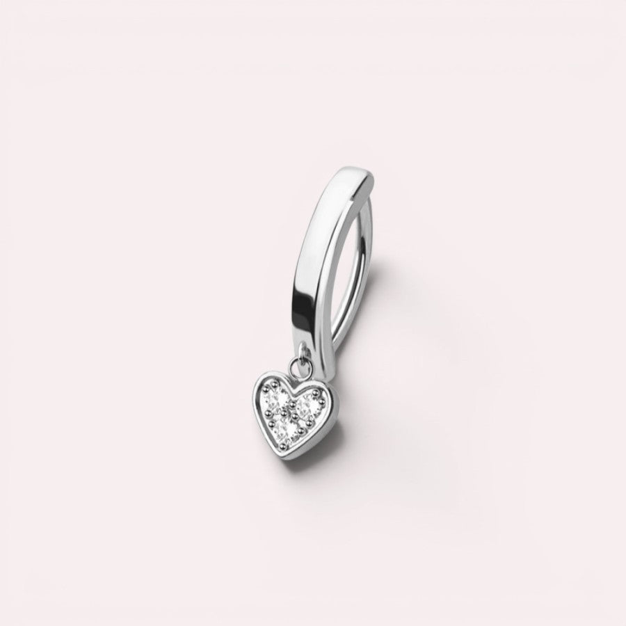 MKBodyJewelry 14g silver surgical steel belly button ring with a dainty dangling heart charm and clear crystals.