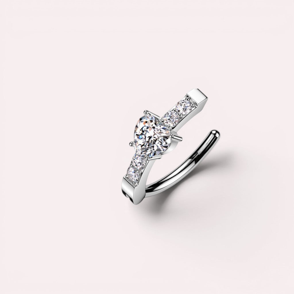 MKBodyJewelry silver heart belly button clicker ring with CZ stones, crafted from surgical steel for 14g piercings.