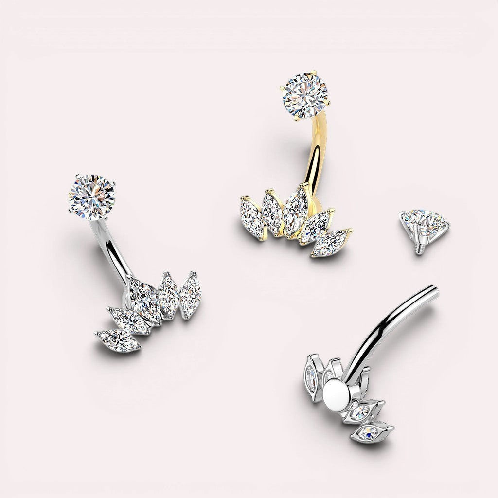 MKBodyJewelry silver and gold belly button rings with marquise-cut cubic zirconia gems in a fan shape.