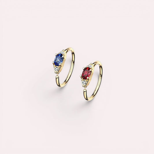 MKBodyJewelry 20g gold nose hoop ring with blue or red gem and clear accent stones. Bendable for nose or cartilage.