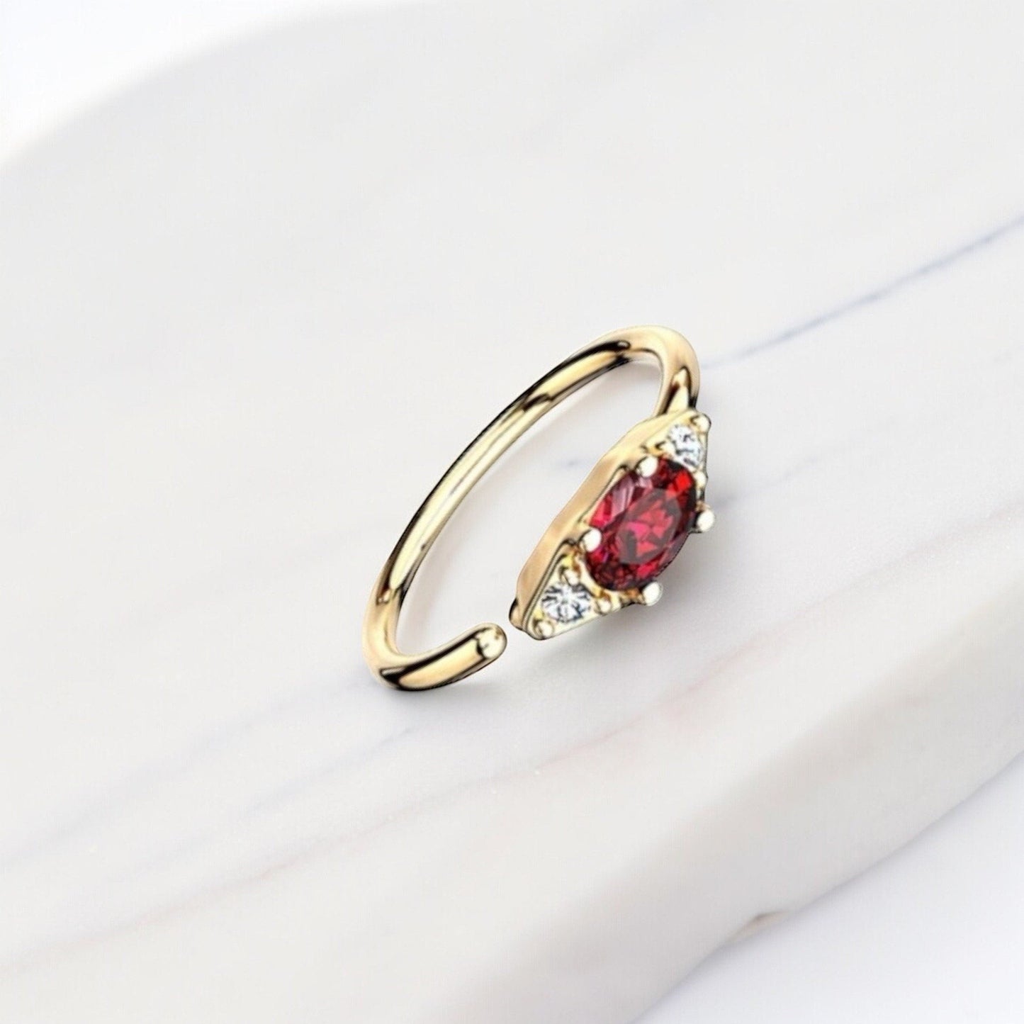 MKBodyJewelry 20g gold nose hoop ring with red oval gem and clear accent stones. Bendable for nose or cartilage.