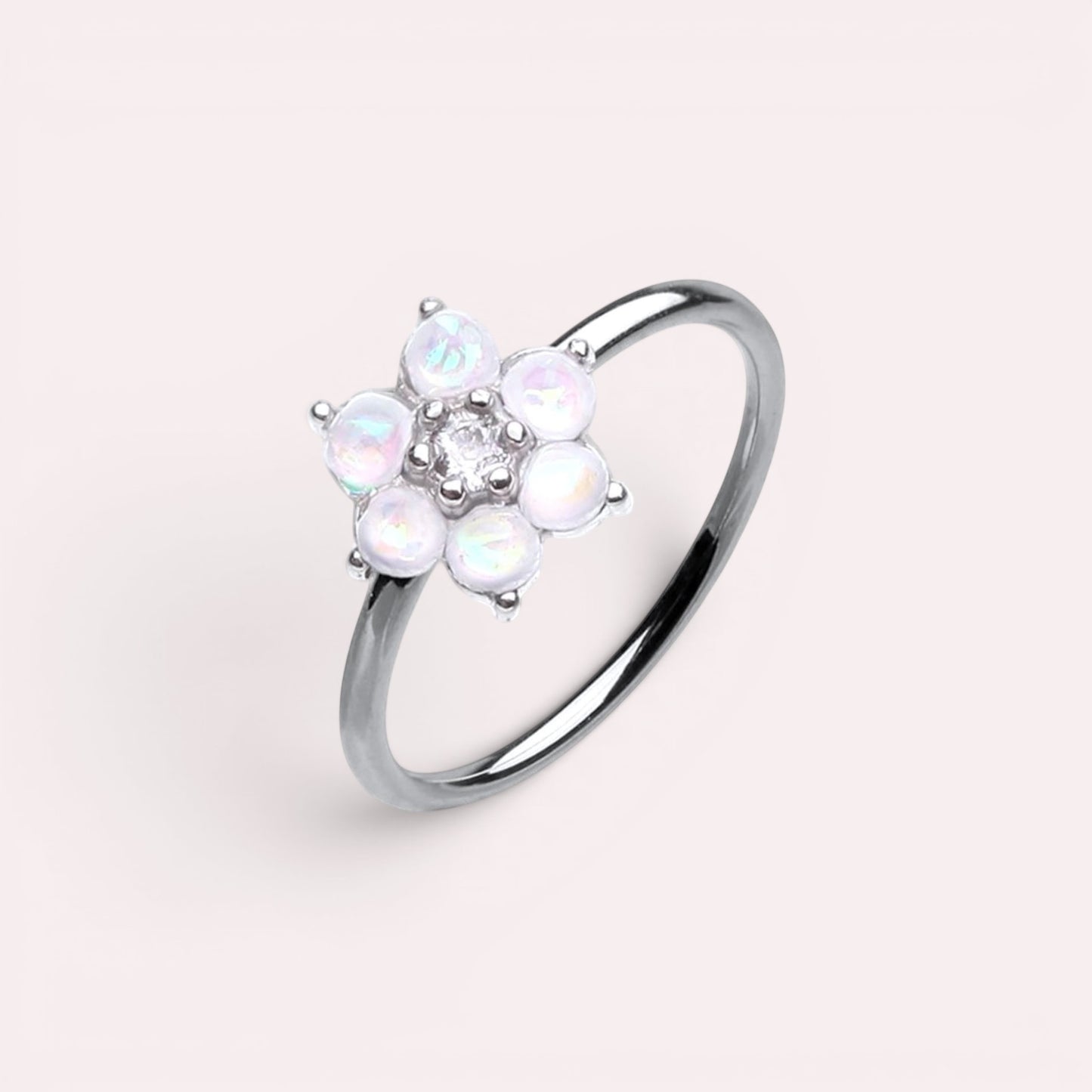 MKBodyJewelry 20g surgical steel nose hoop featuring a white opal flower design, suitable for cartilage piercings.