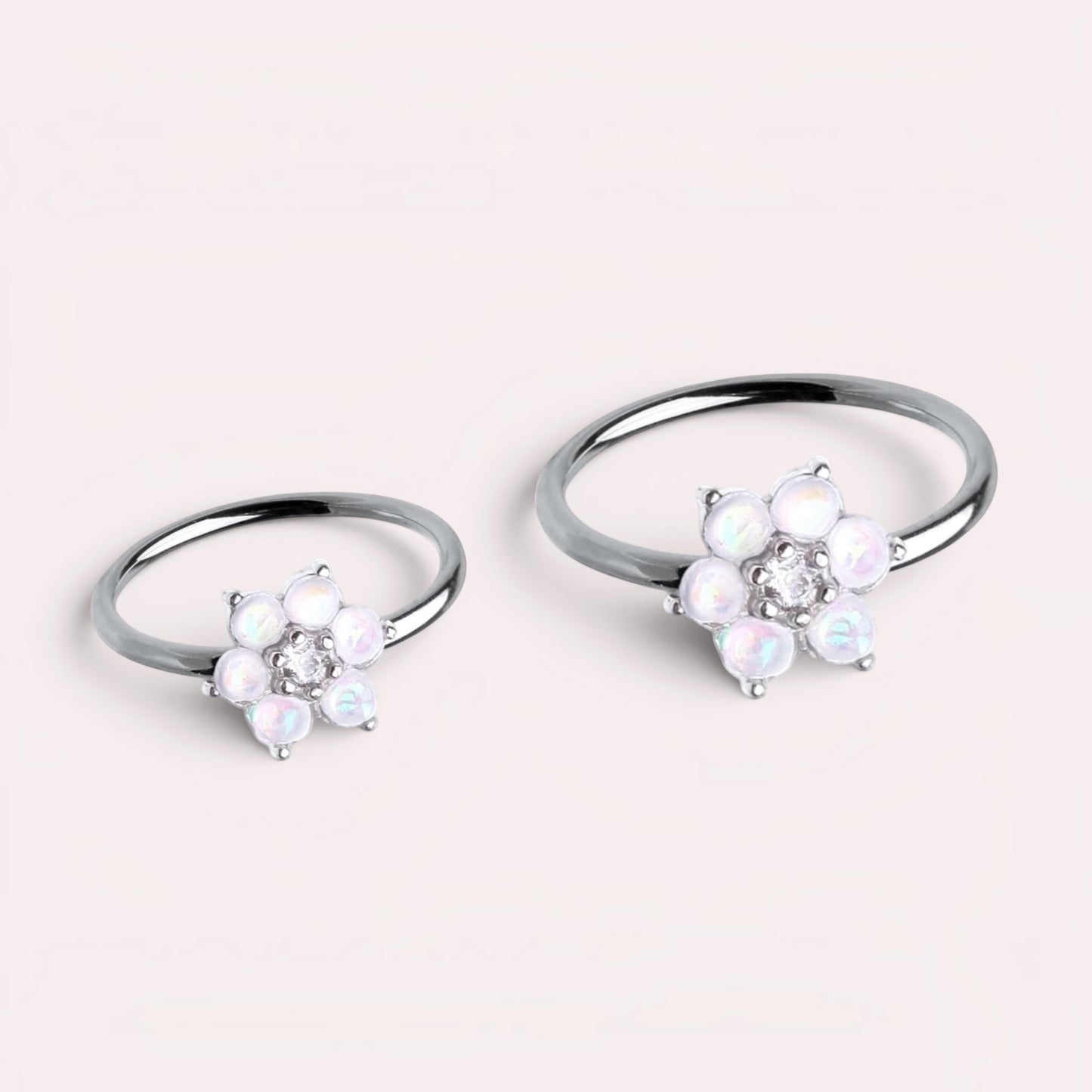 MKBodyJewelry 20g surgical steel nose hoop rings featuring white opal flower designs for nose or cartilage piercings.