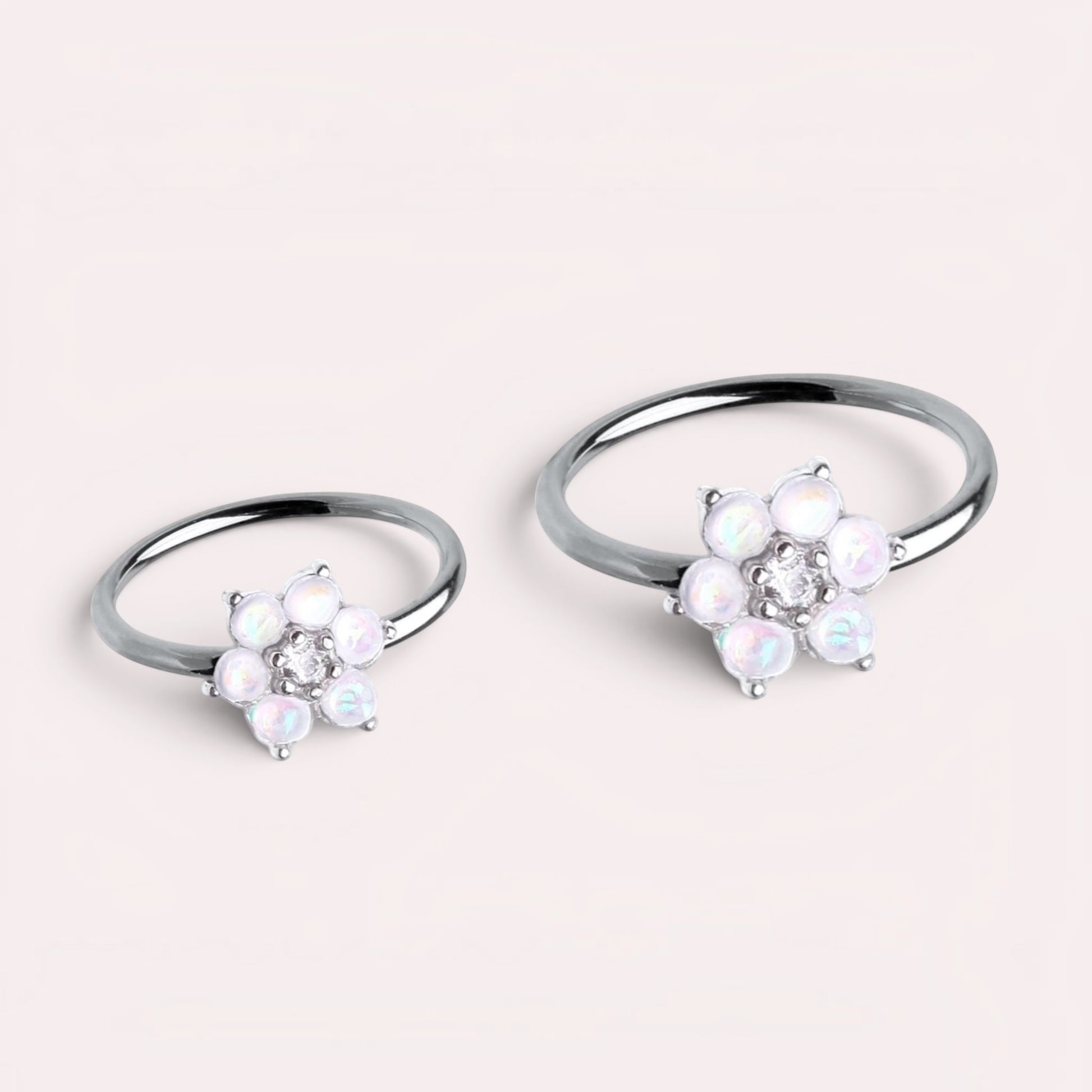 MKBodyJewelry 20g surgical steel nose hoop rings featuring white opal flower designs for nose or cartilage piercings.