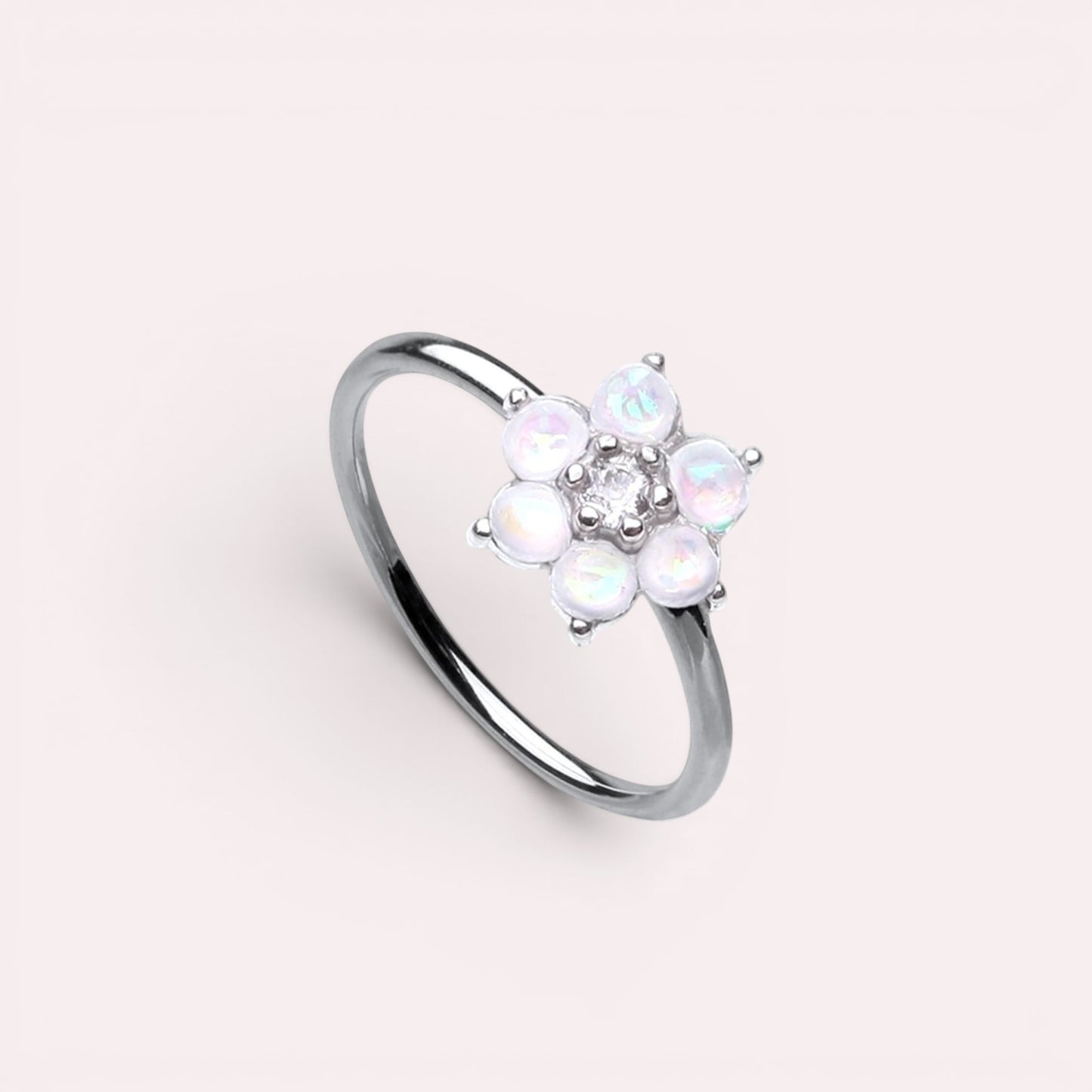 MKBodyJewelry 20g surgical steel nose hoop featuring a white opal flower design, suitable for cartilage piercings.