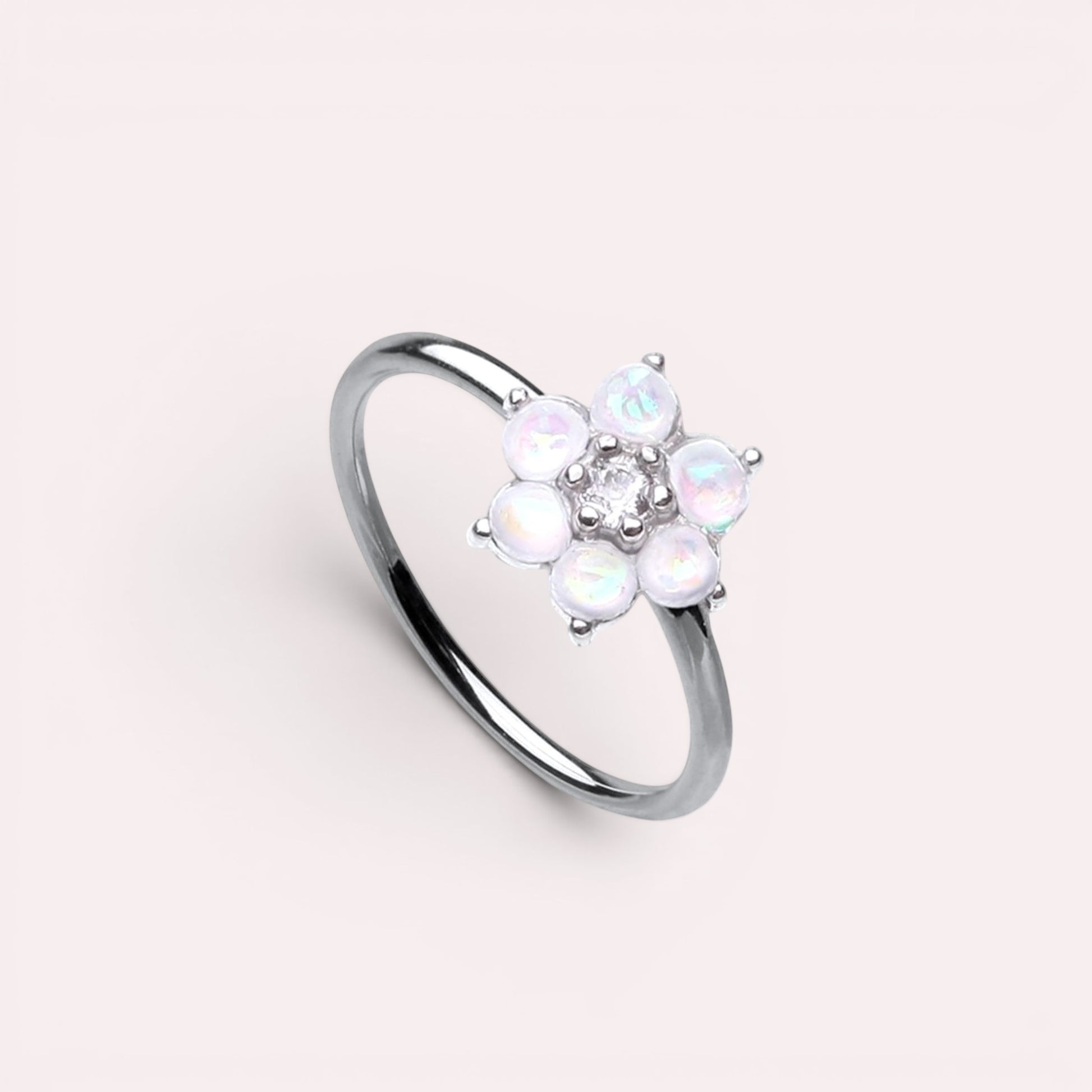 MKBodyJewelry 20g surgical steel nose hoop featuring a white opal flower design, suitable for cartilage piercings.