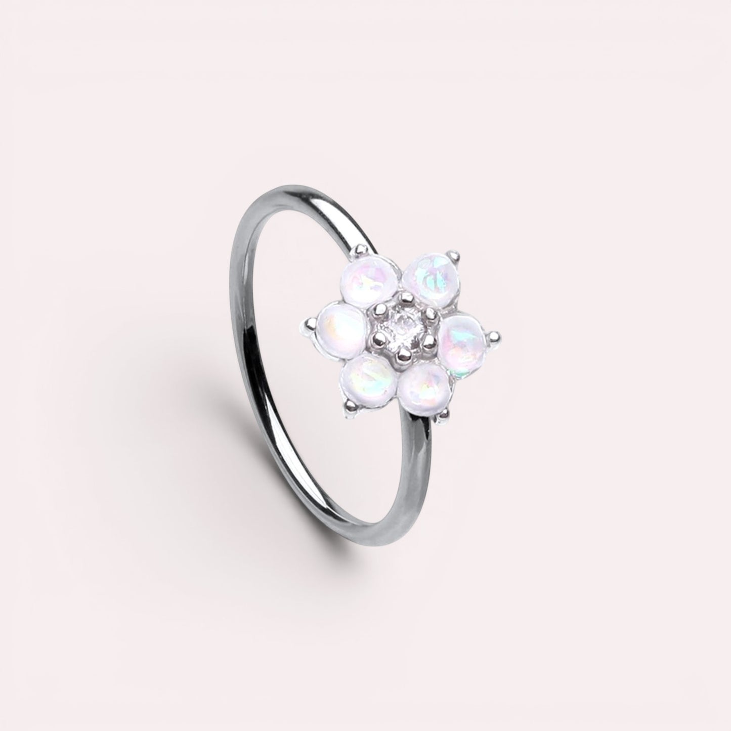 MKBodyJewelry 20g surgical steel nose hoop featuring a white opal flower design, suitable for cartilage piercings.