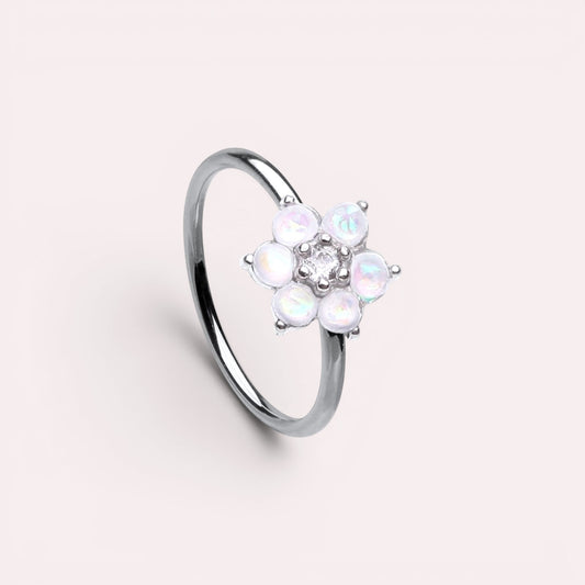 MKBodyJewelry 20g surgical steel nose hoop featuring a white opal flower design, suitable for cartilage piercings.