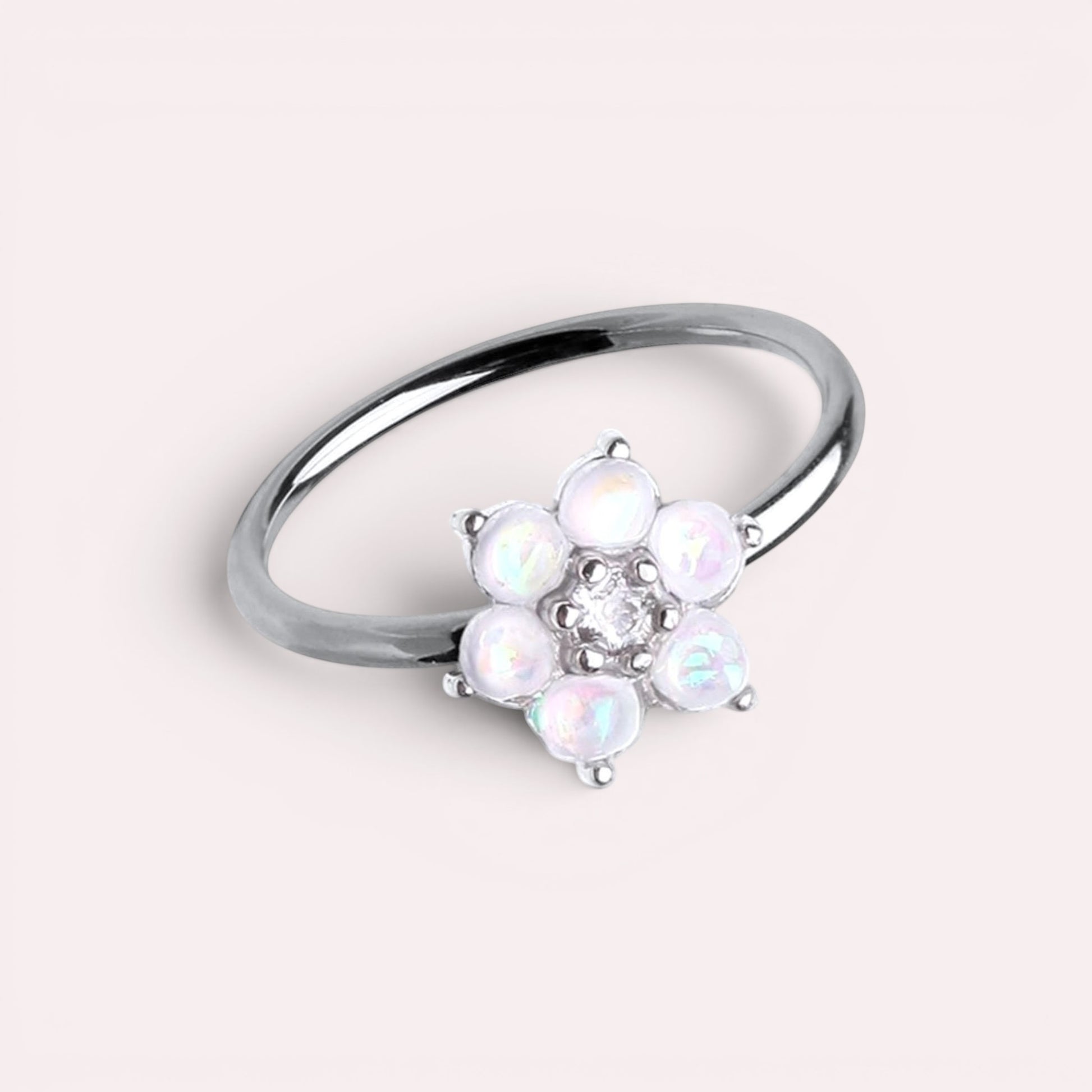MKBodyJewelry 20g surgical steel nose hoop featuring a white opal flower design, suitable for cartilage piercings.