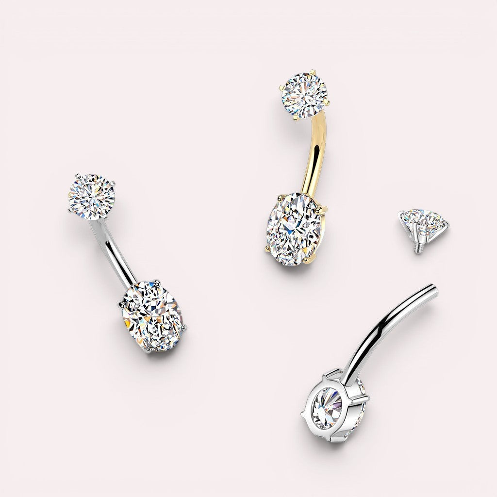 MKBodyJewelry gold-tone surgical stainless steel belly button ring with oval cubic zirconia and round top gem.