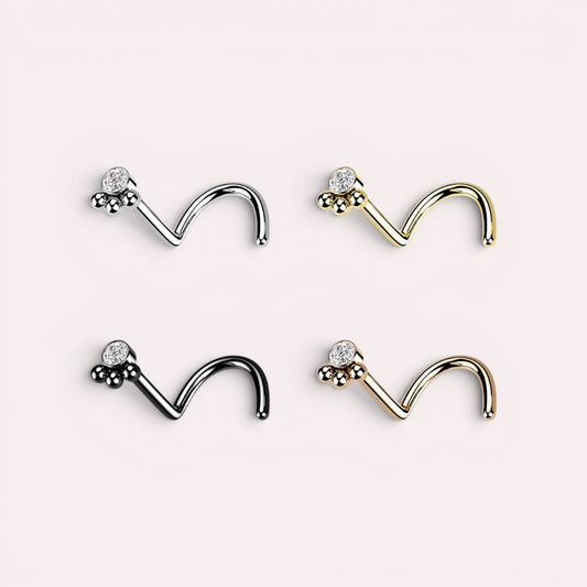 MKBodyJewelry 20G stainless steel L-shape nose studs with dainty paw print designs in silver, gold, black, and rose gold