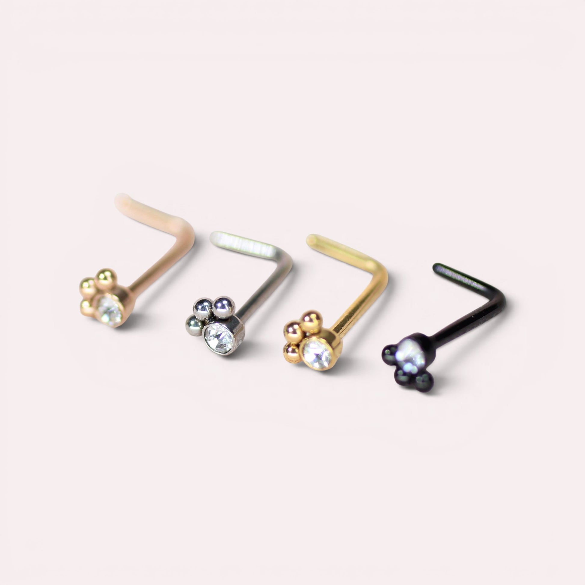MKBodyJewelry 20G stainless steel L-shape nose studs featuring dainty paw print designs with clear crystals