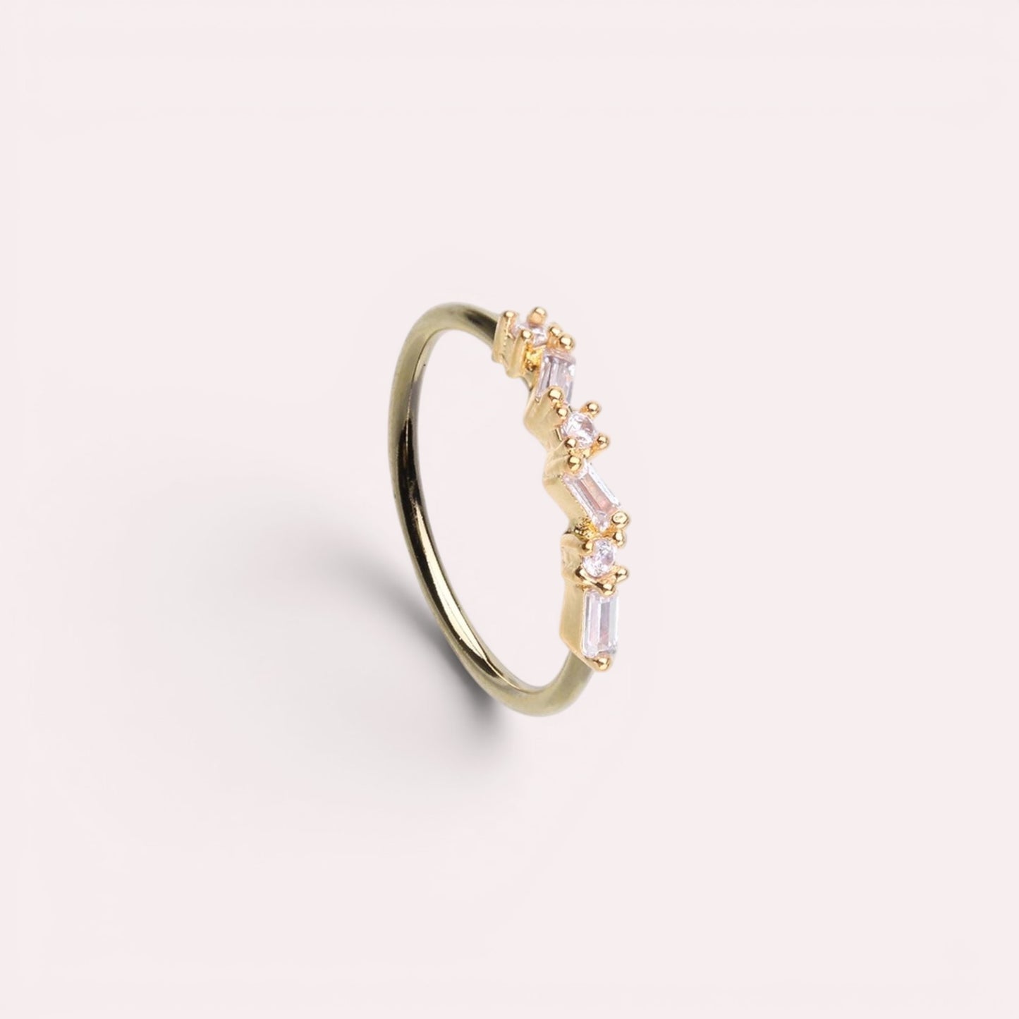 MKBodyJewelry 20g gold surgical steel nose hoop with a pink baguette gem zig zag design for cartilage piercings.