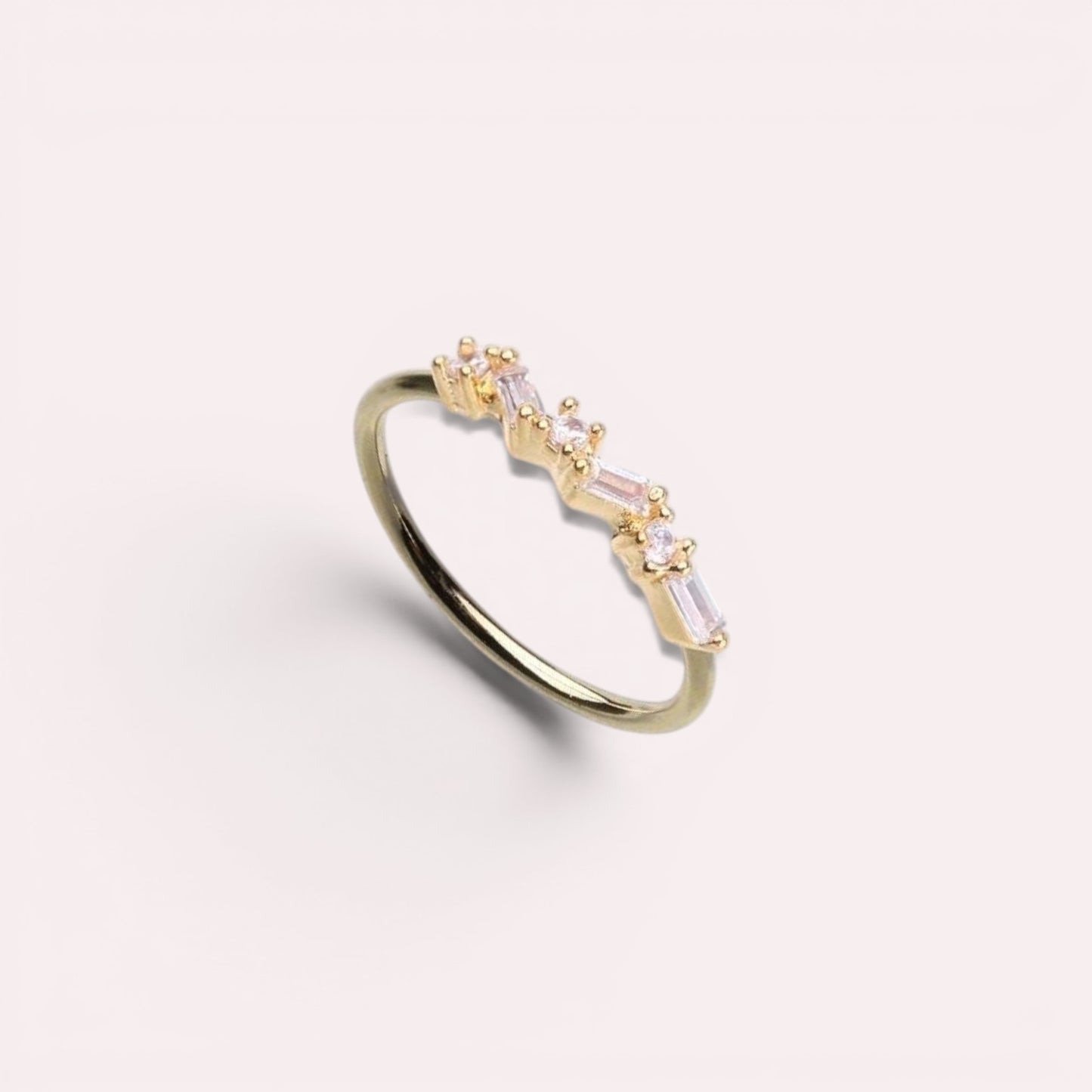 MKBodyJewelry 20g gold surgical steel nose hoop with pink baguette gems in a dainty zig zag design.