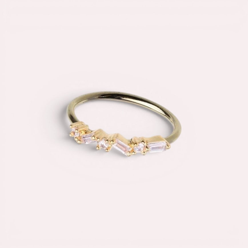 MKBodyJewelry 20g gold surgical steel nose hoop with pink baguette gems in a dainty zig zag design.