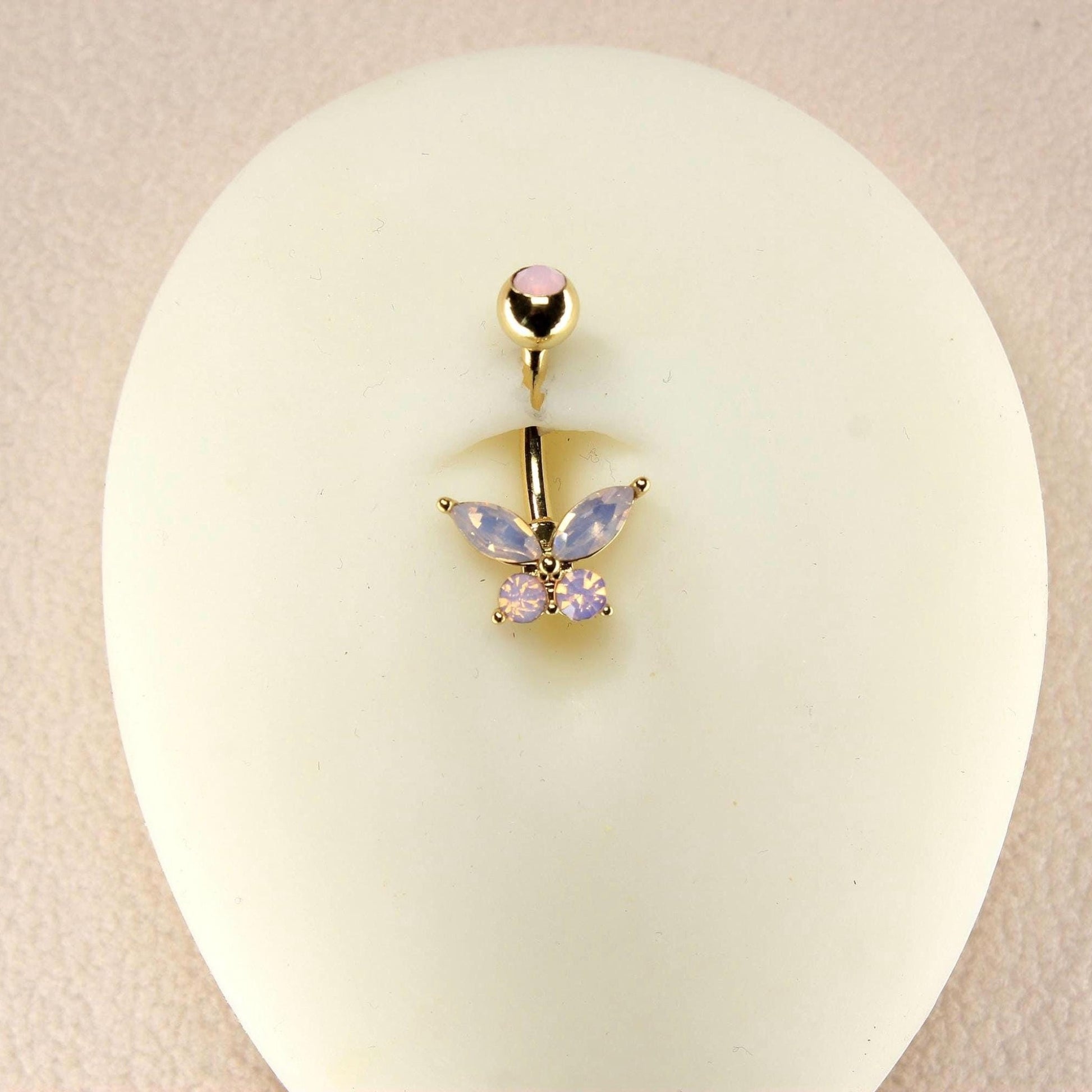 MKBodyJewelry 14g gold surgical steel belly button ring featuring a pink butterfly charm with sparkling CZ stones.