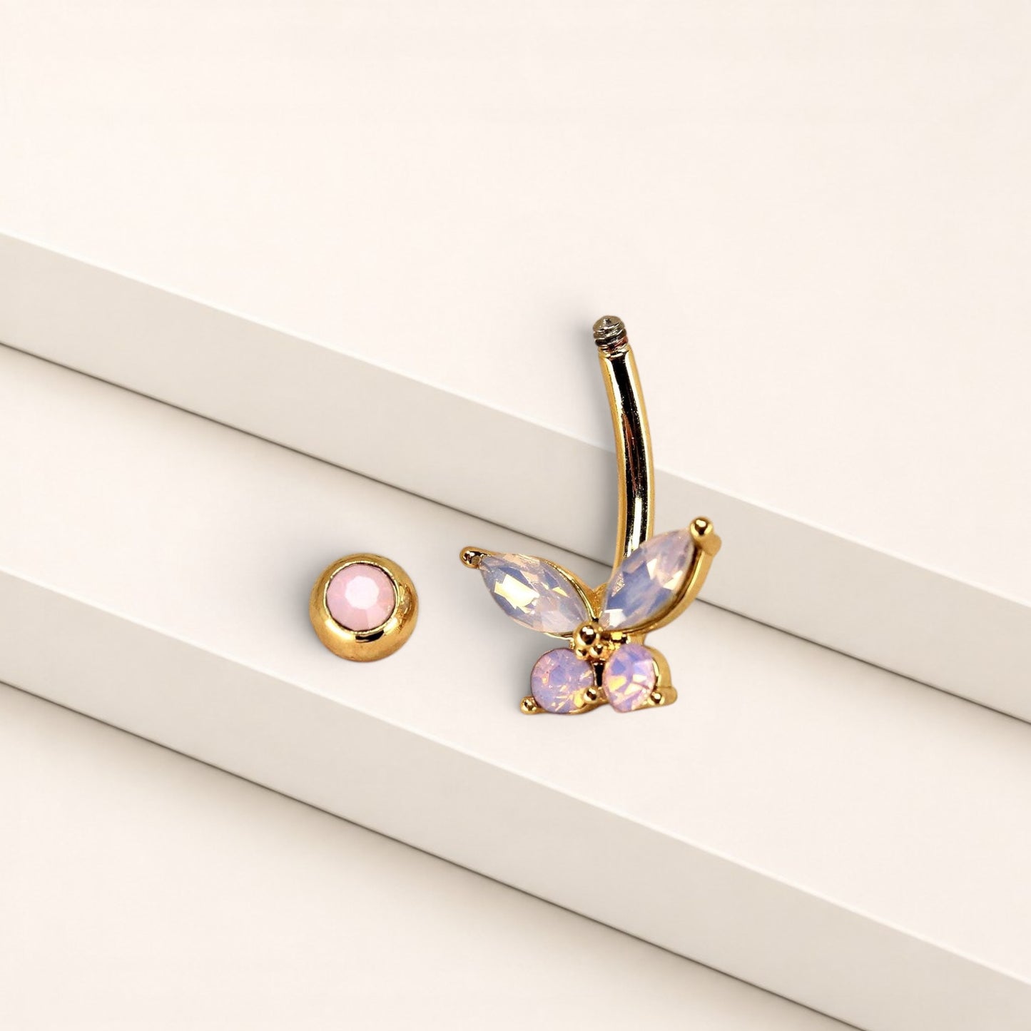 MKBodyJewelry 14g surgical steel navel ring featuring a pink butterfly charm with sparkling CZ stones.