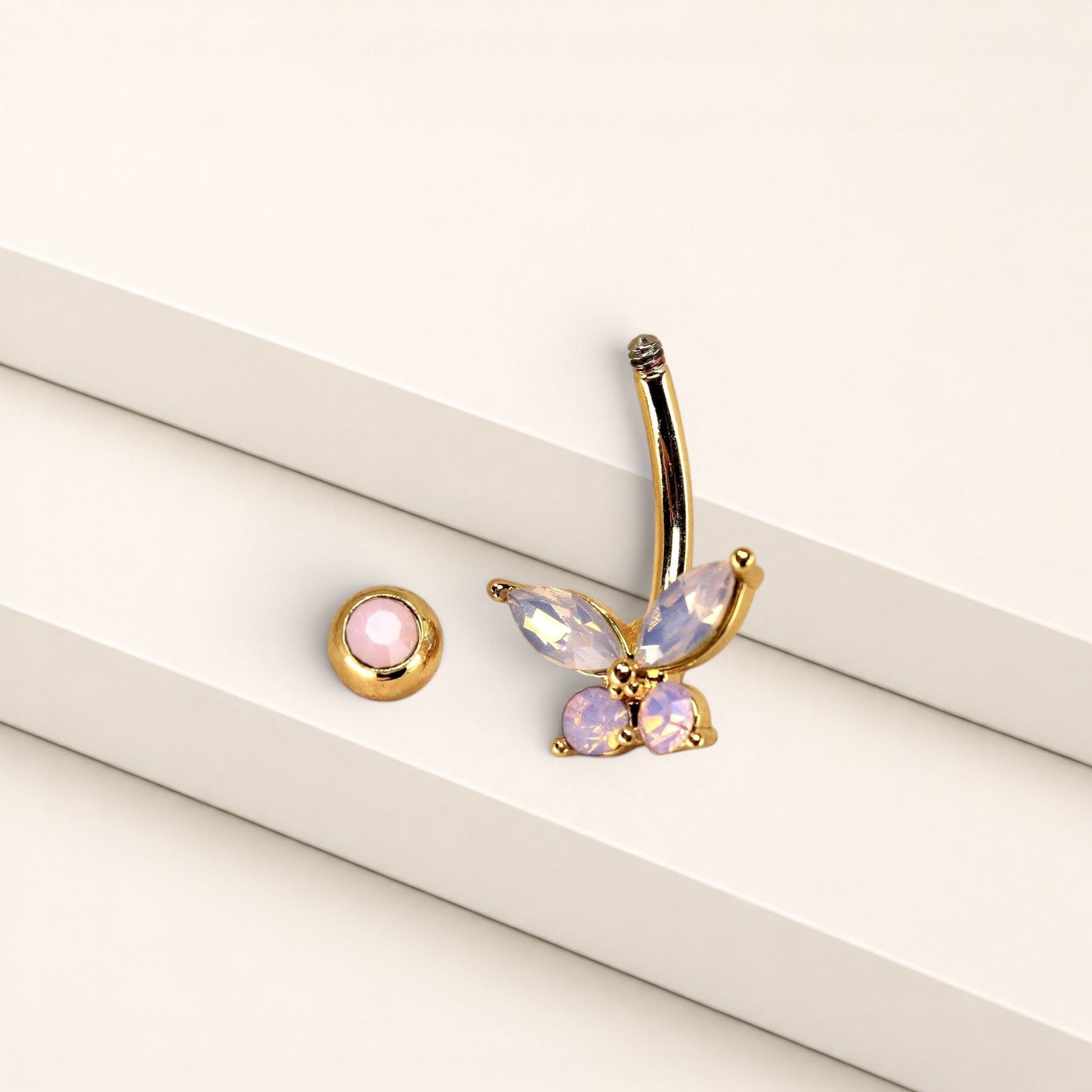 MKBodyJewelry 14g surgical steel navel ring featuring a pink butterfly charm with sparkling CZ stones.