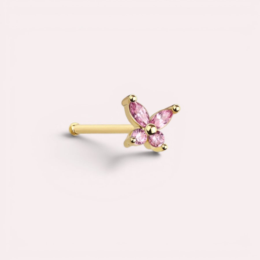 MKBodyJewelry dainty gold nose stud featuring a sparkly pink gemstone butterfly design with a 20g thin post.