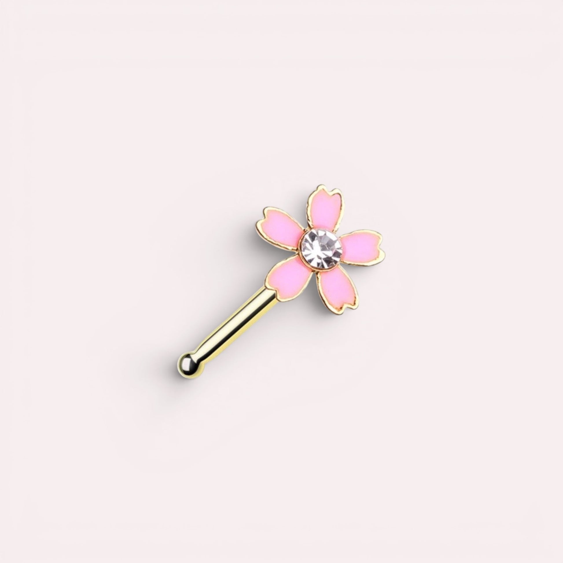 MKBodyJewelry 20G pink flower nose bone stud in surgical steel with a central crystal gem for daily wear.