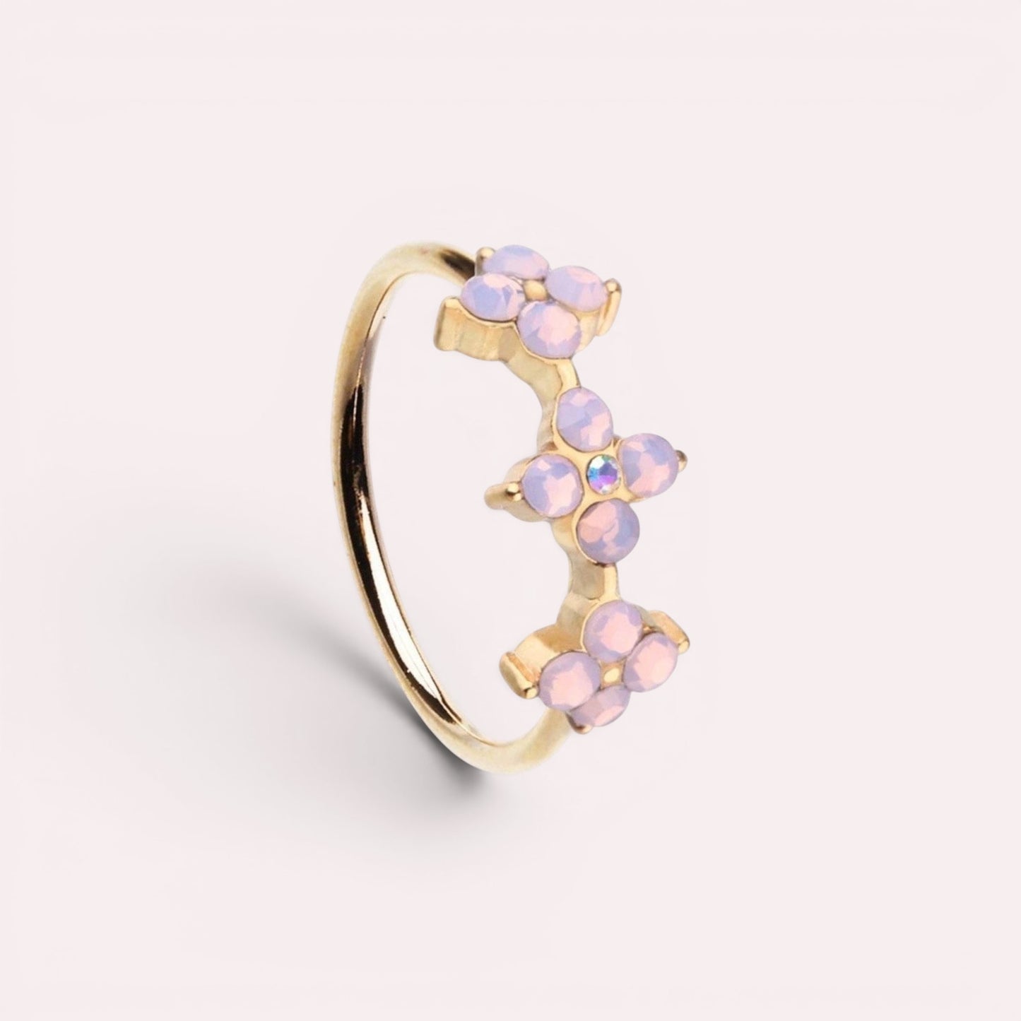 MKBodyJewelry 20g gold surgical steel nose hoop featuring three pink opal flower charms for nose or cartilage piercing