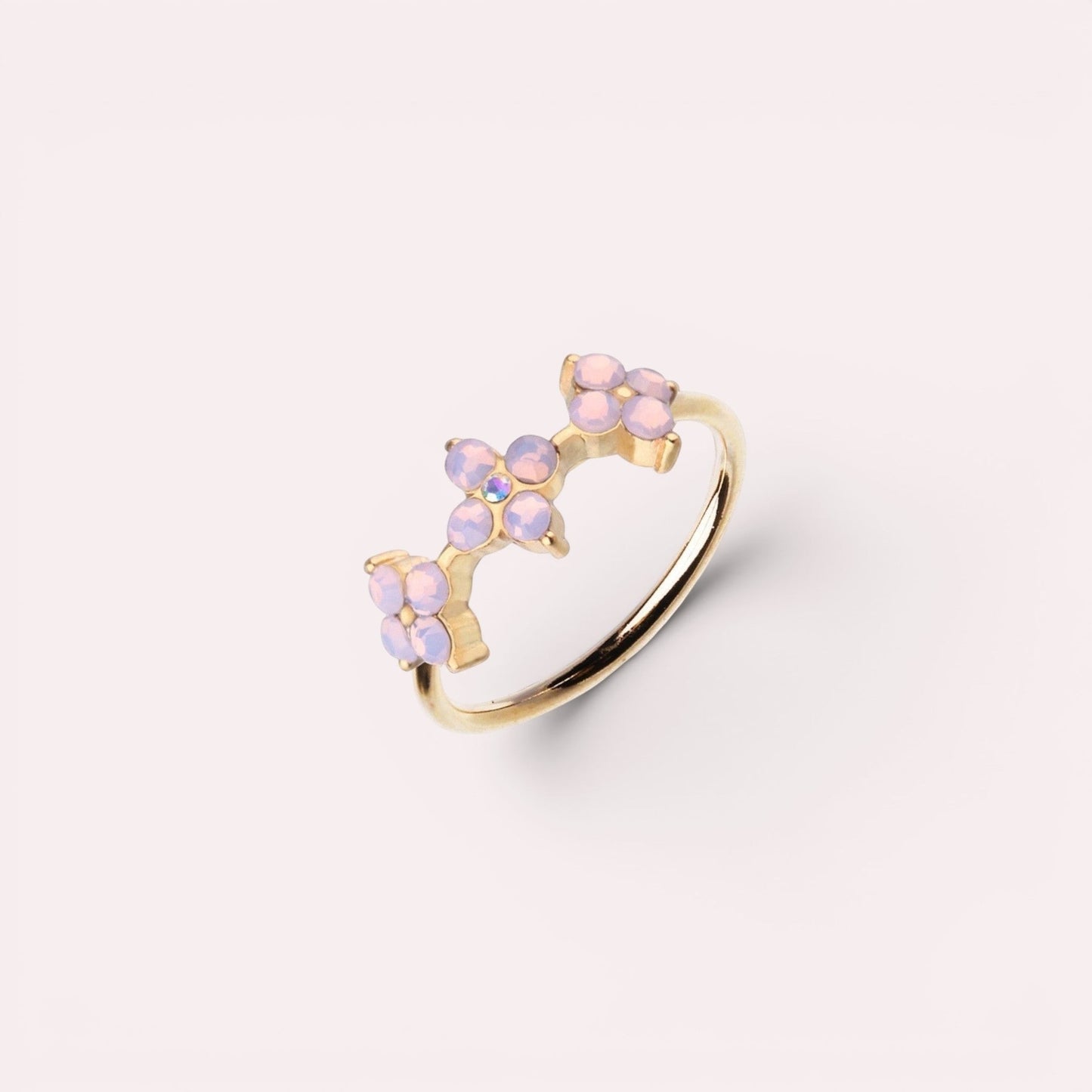 MKBodyJewelry 20g gold surgical steel nose hoop featuring a delicate trio of pink opal flower accents.
