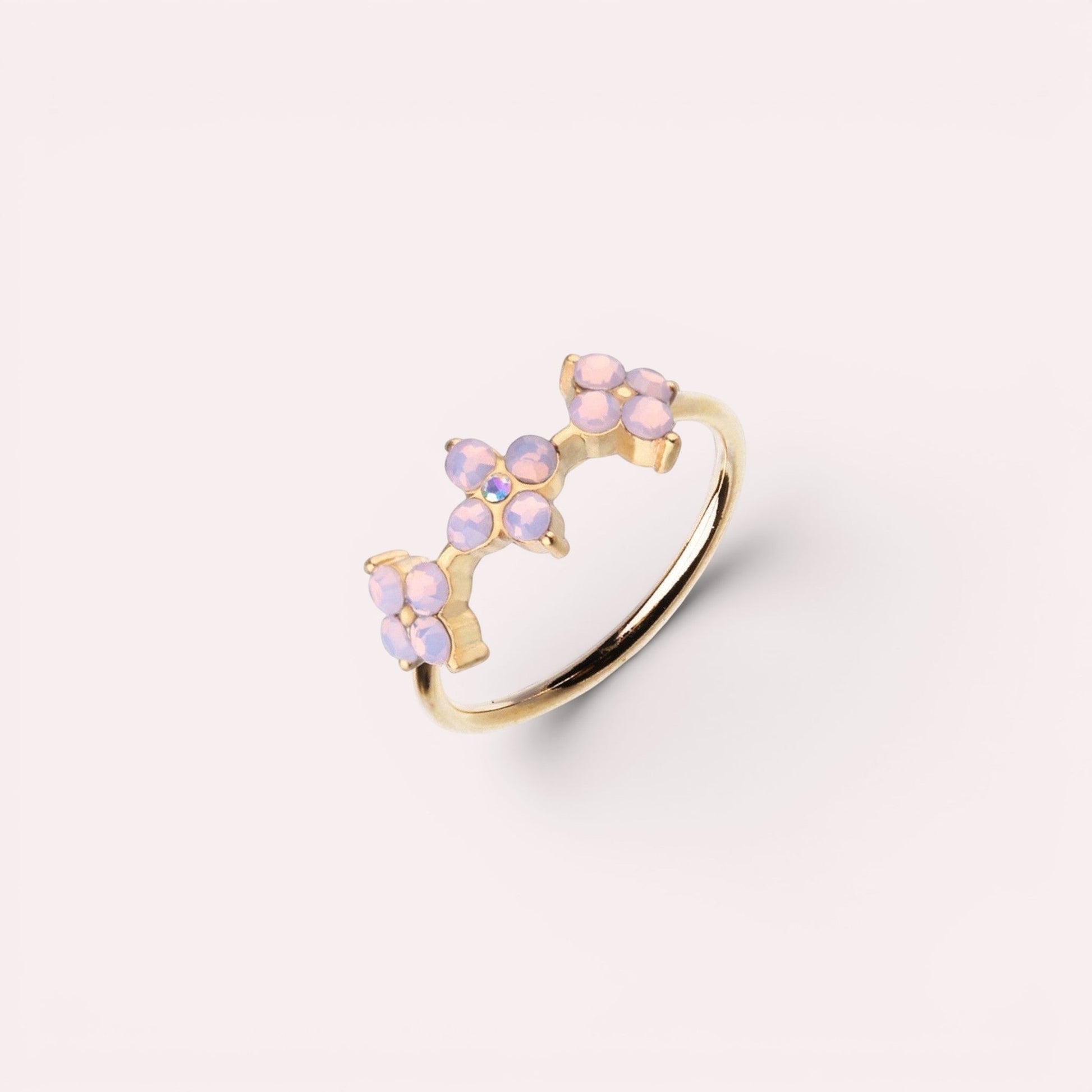 MKBodyJewelry 20g gold surgical steel nose hoop featuring a delicate trio of pink opal flower accents.