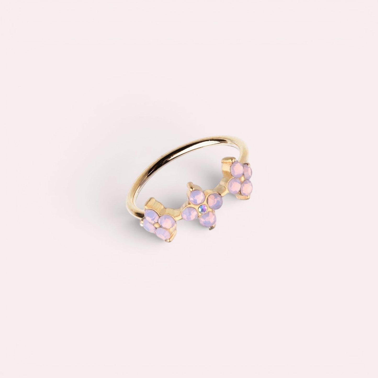 MKBodyJewelry 20g gold surgical steel nose hoop featuring three delicate pink opal flower accents for piercings.