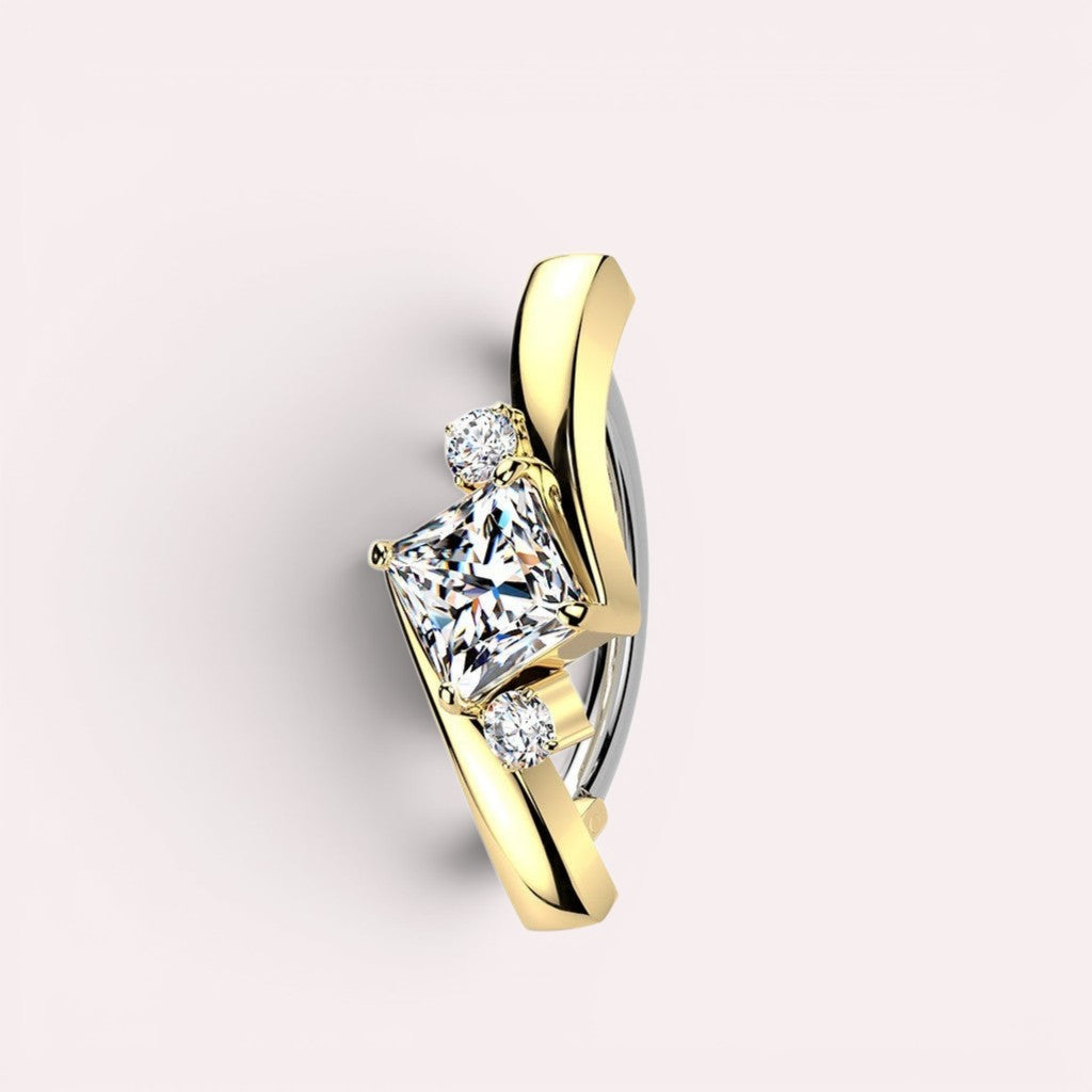 MKBodyJewelry Princess Cut Gemstone Ear Cuff with yellow gold and sterling silver finish, featuring a central princess-cut stone flanked by smaller stones.