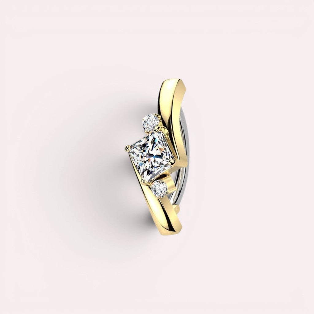 MKBodyJewelry Princess Cut Gemstone Ear Cuff with yellow gold and sterling silver finish, featuring a central princess-cut stone flanked by smaller stones.