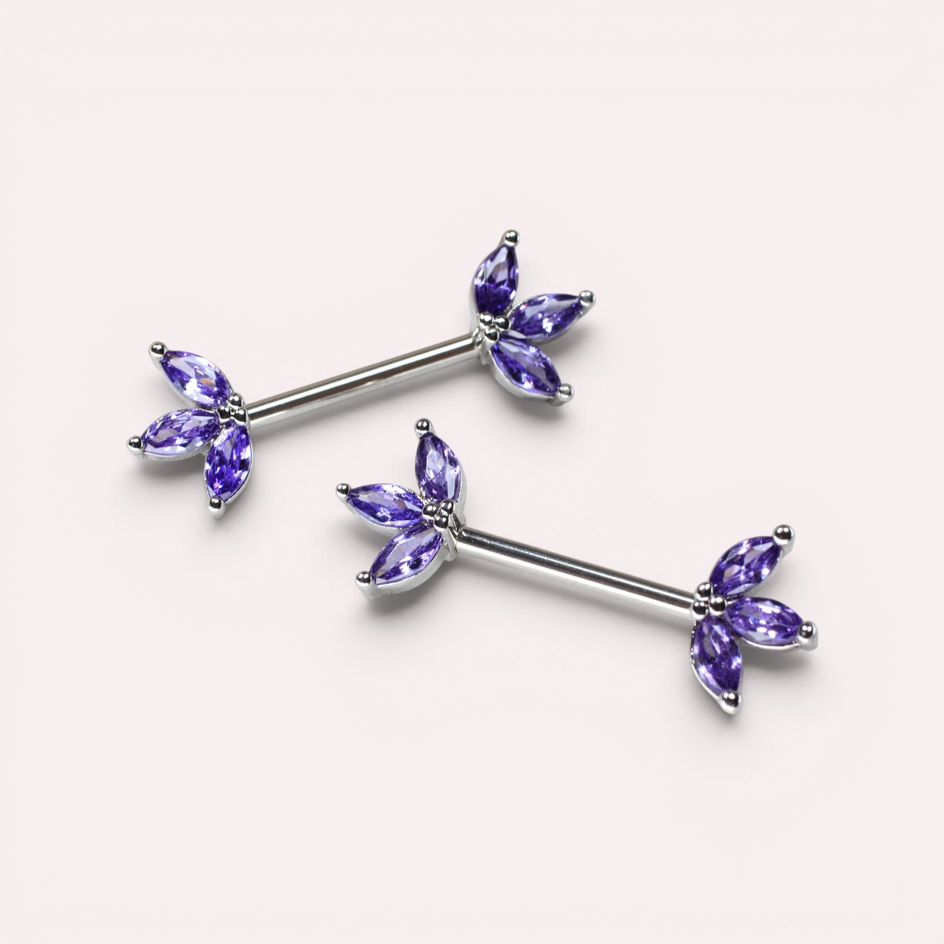 MKBodyJewelry 14G surgical steel nipple barbell pair featuring purple marquise lotus leaf floral gem accents.