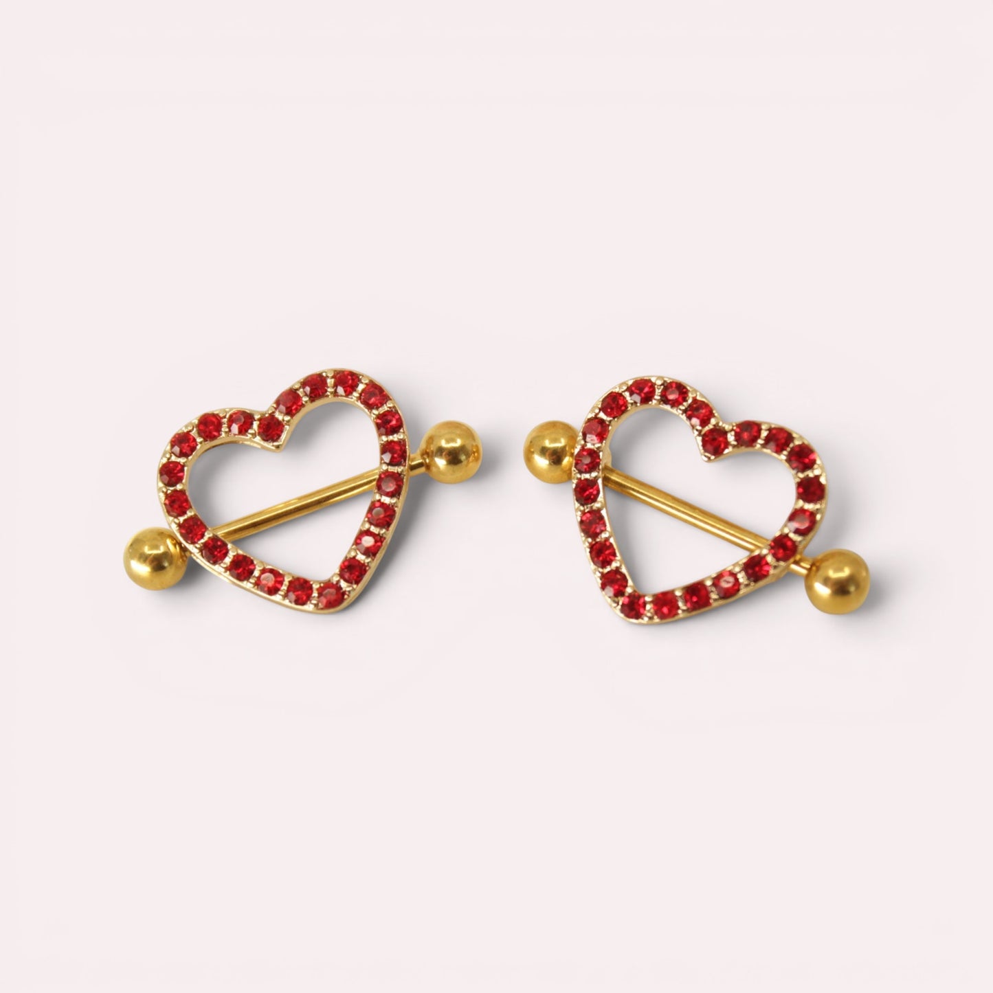 MKBodyJewelry 14g gold barbell with red heart shield paved with sparkling gems. Surgical steel.