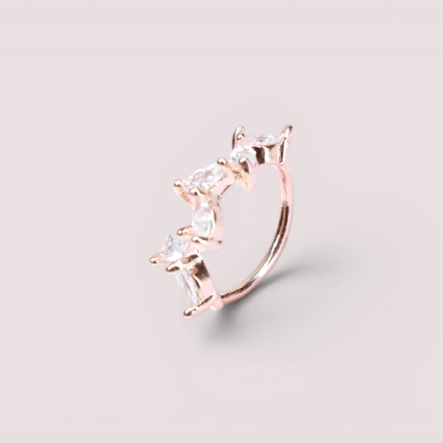 MKBodyJewelry 20g rose gold surgical steel nose hoop featuring a dainty leaf design with sparkling CZ stones.