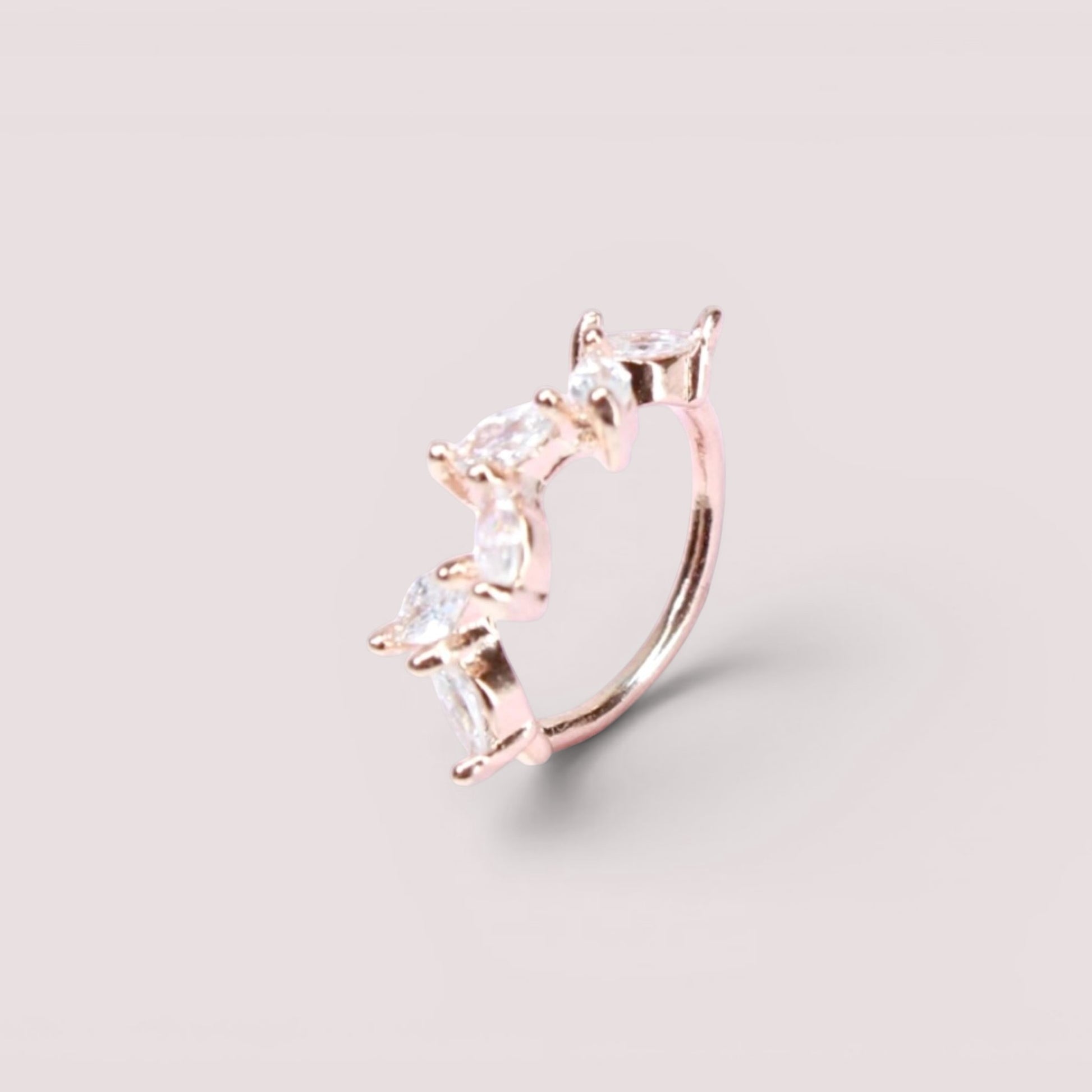 MKBodyJewelry 20g rose gold surgical steel nose hoop featuring a dainty leaf design with sparkling CZ stones.