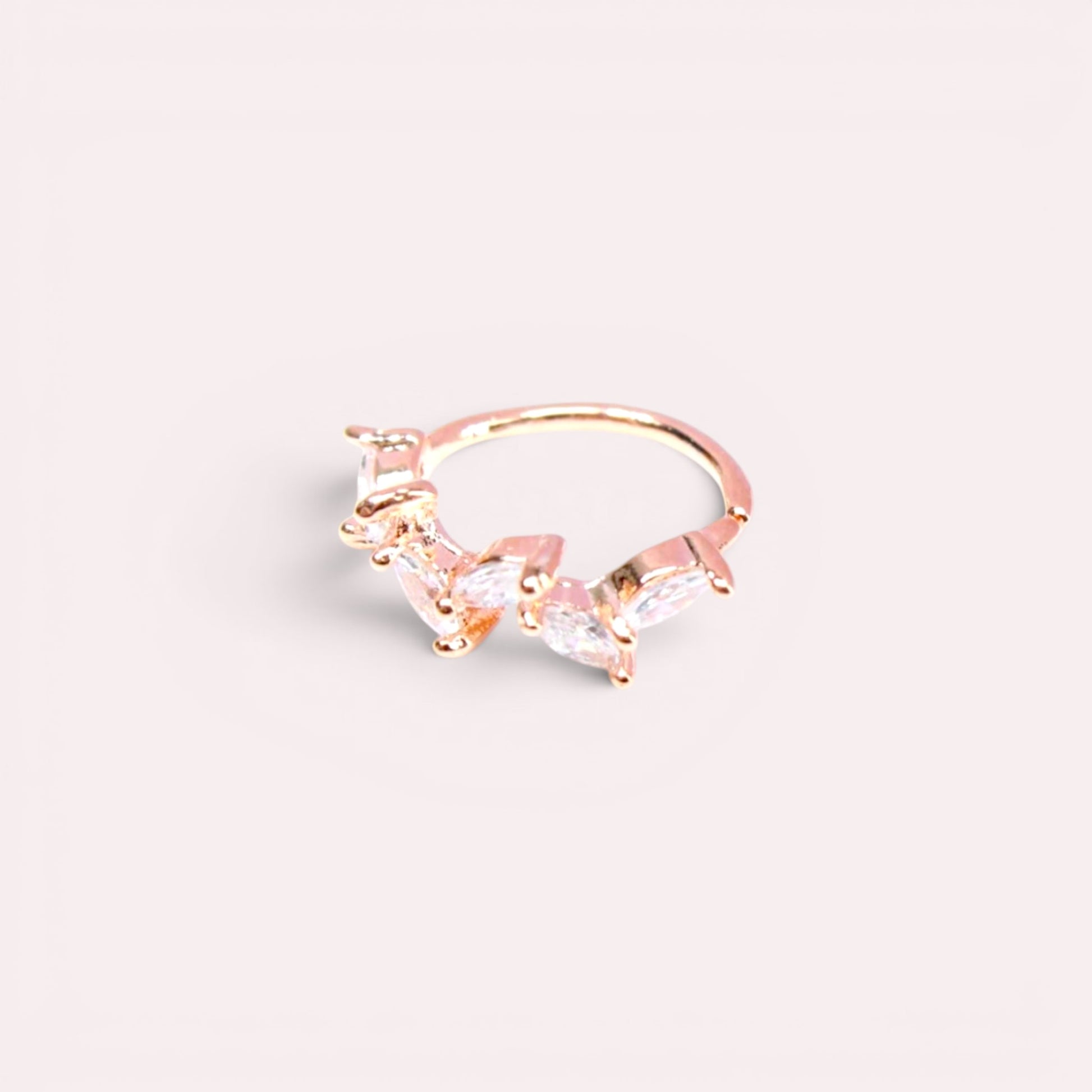 MKBodyJewelry 20G rose gold surgical steel nose hoop featuring a dainty CZ crystal leaf design for cartilage piercing.