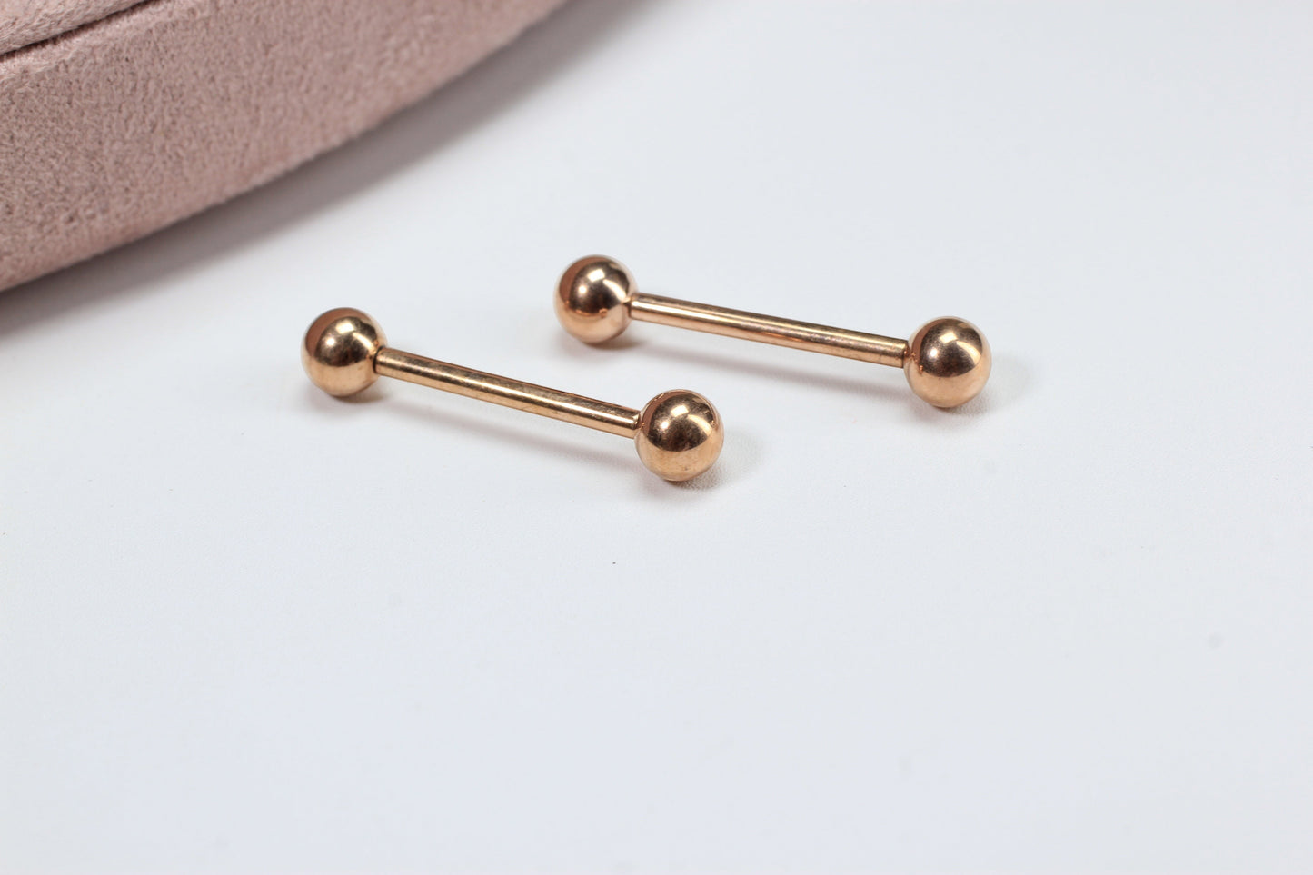 MKBodyJewelry rose gold titanium 14g internally threaded nipple barbell with ball ends. Minimalist, hypoallergenic jewelry.