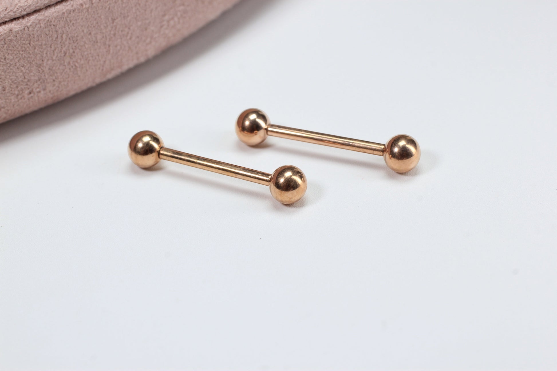 MKBodyJewelry rose gold titanium 14g internally threaded nipple barbell with ball ends. Minimalist, hypoallergenic jewelry.