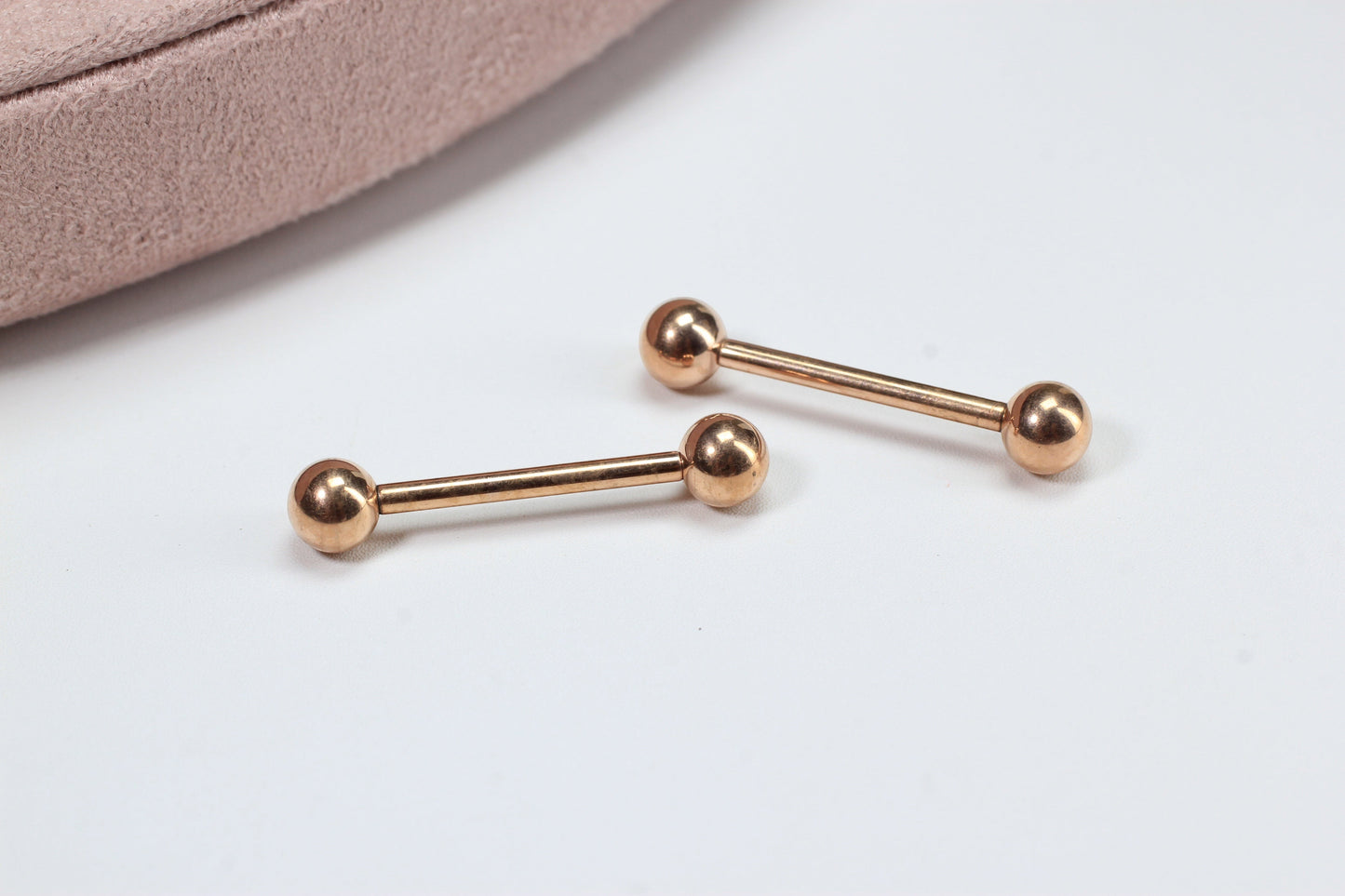 MKBodyJewelry rose gold titanium 14g internally threaded nipple barbell with simple ball ends. Hypoallergenic and minimalist design.
