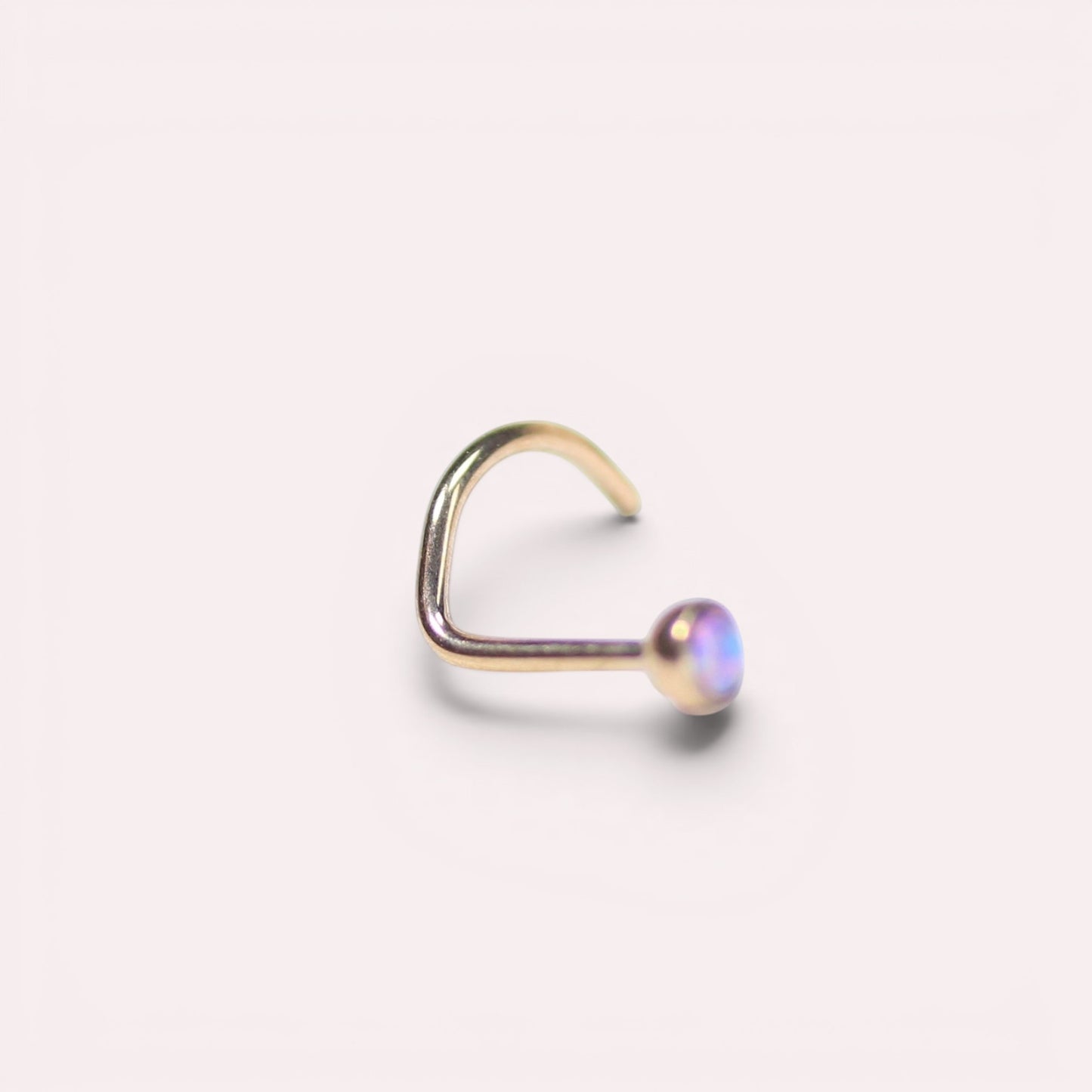 MKBodyJewelry rose gold titanium nose stud with a round opal gem and secure corkscrew post for sensitive skin.