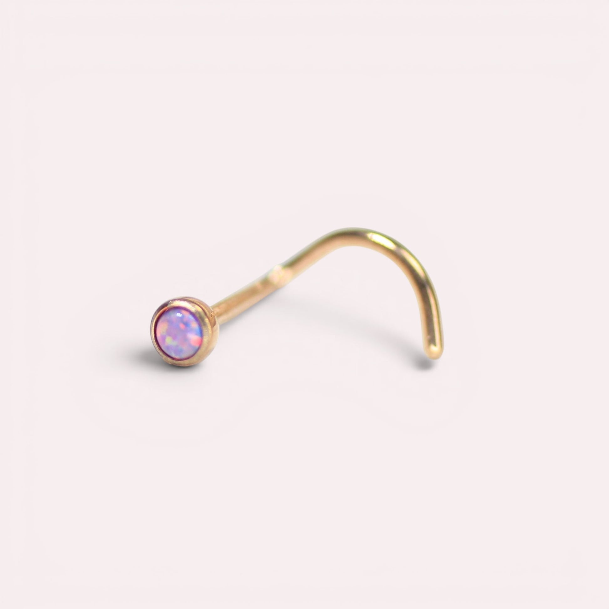 MKBodyJewelry rose gold titanium nose stud with a 2.5mm round opal gem and a secure corkscrew post.