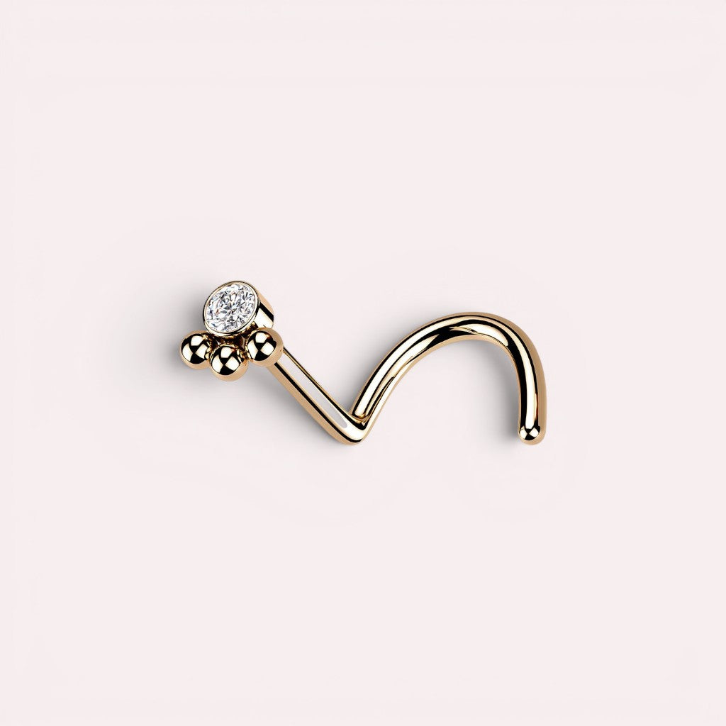 MKBodyJewelry 20G rose gold stainless steel L-shape nose stud featuring a dainty paw print design with a clear stone.