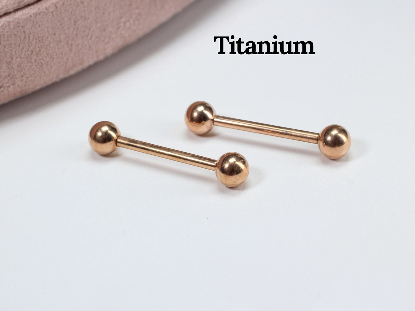 MKBodyJewelry rose gold titanium 14g internally threaded nipple barbell with ball ends. Hypoallergenic and minimalist.