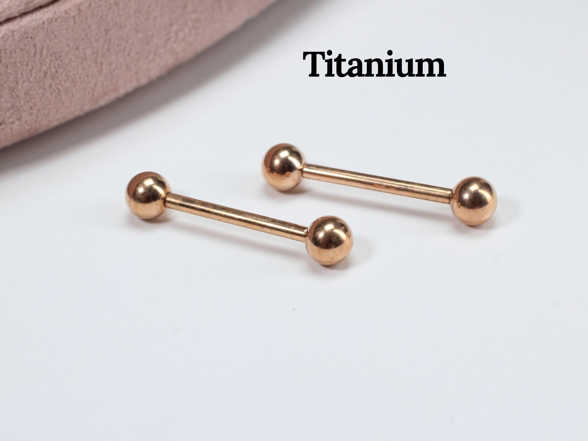 MKBodyJewelry rose gold titanium 14g internally threaded nipple barbell with ball ends. Hypoallergenic and minimalist.