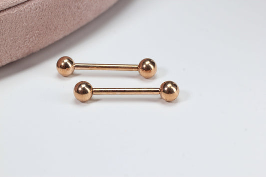 MKBodyJewelry rose gold titanium 14g internally threaded nipple barbell with smooth ball ends. Hypoallergenic and minimalist design.