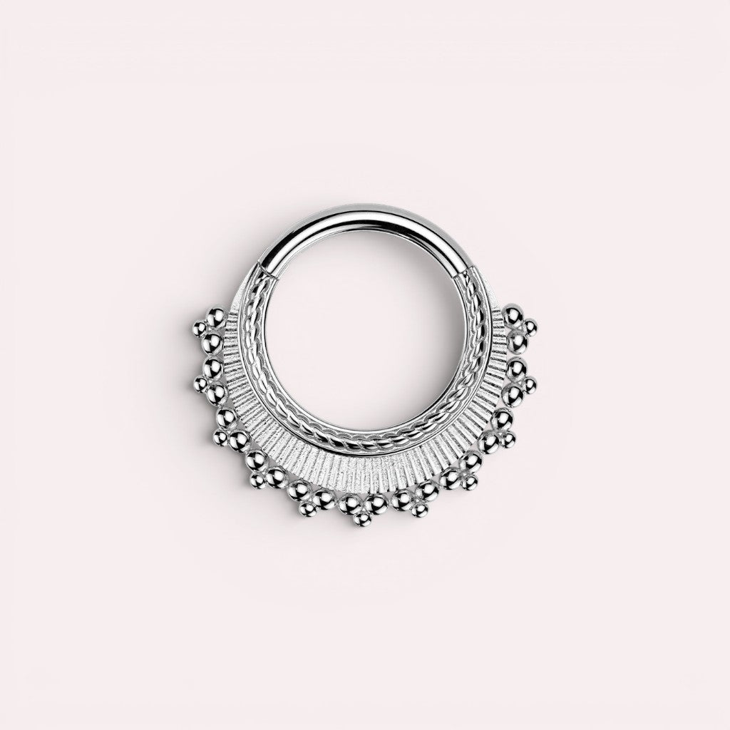 MKBodyJewelry 16g silver beaded tribal style septum clicker ring made of surgical steel. Hinged closure.