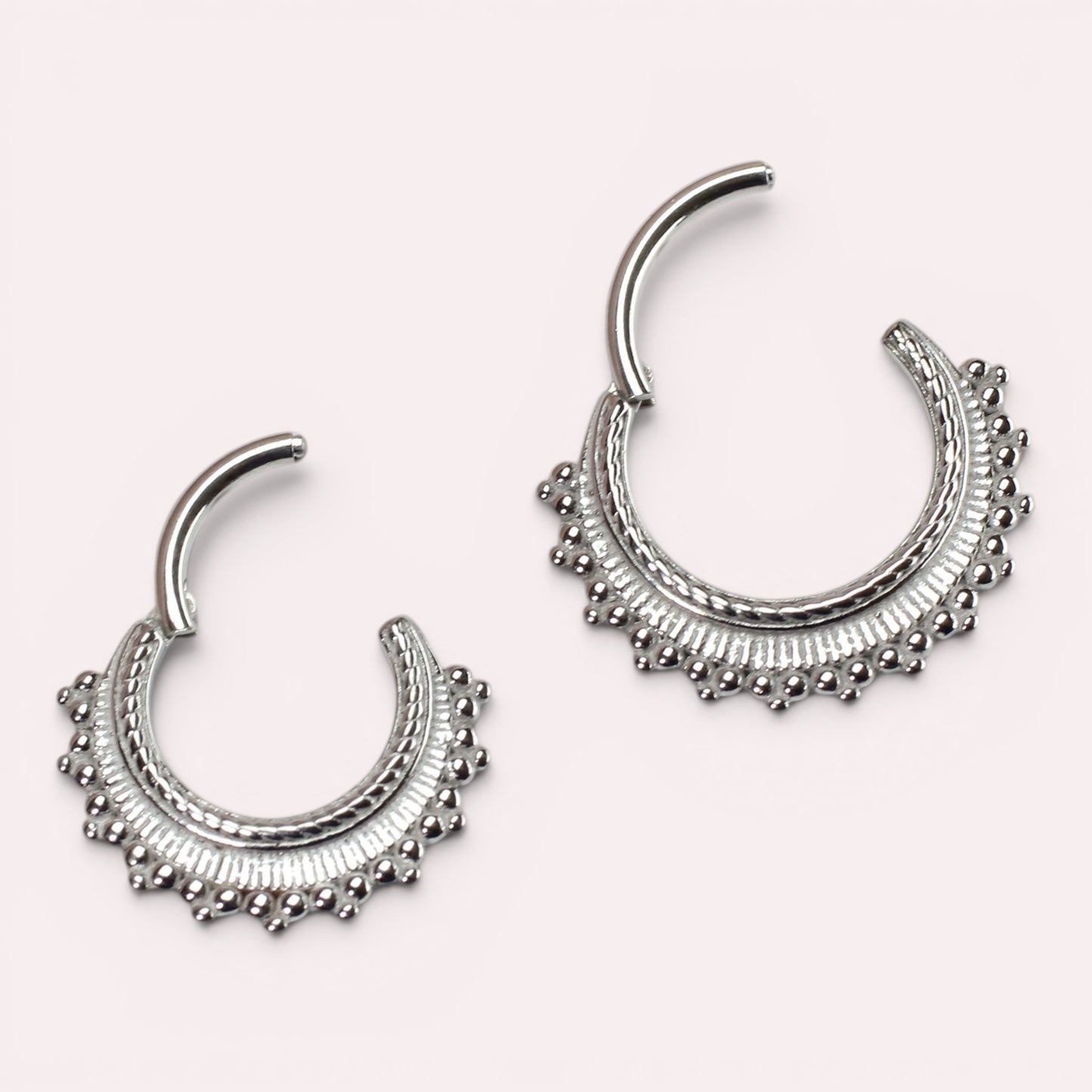 MKBodyJewelry 16g silver beaded tribal style septum clicker ring made of surgical steel with hinged closure.