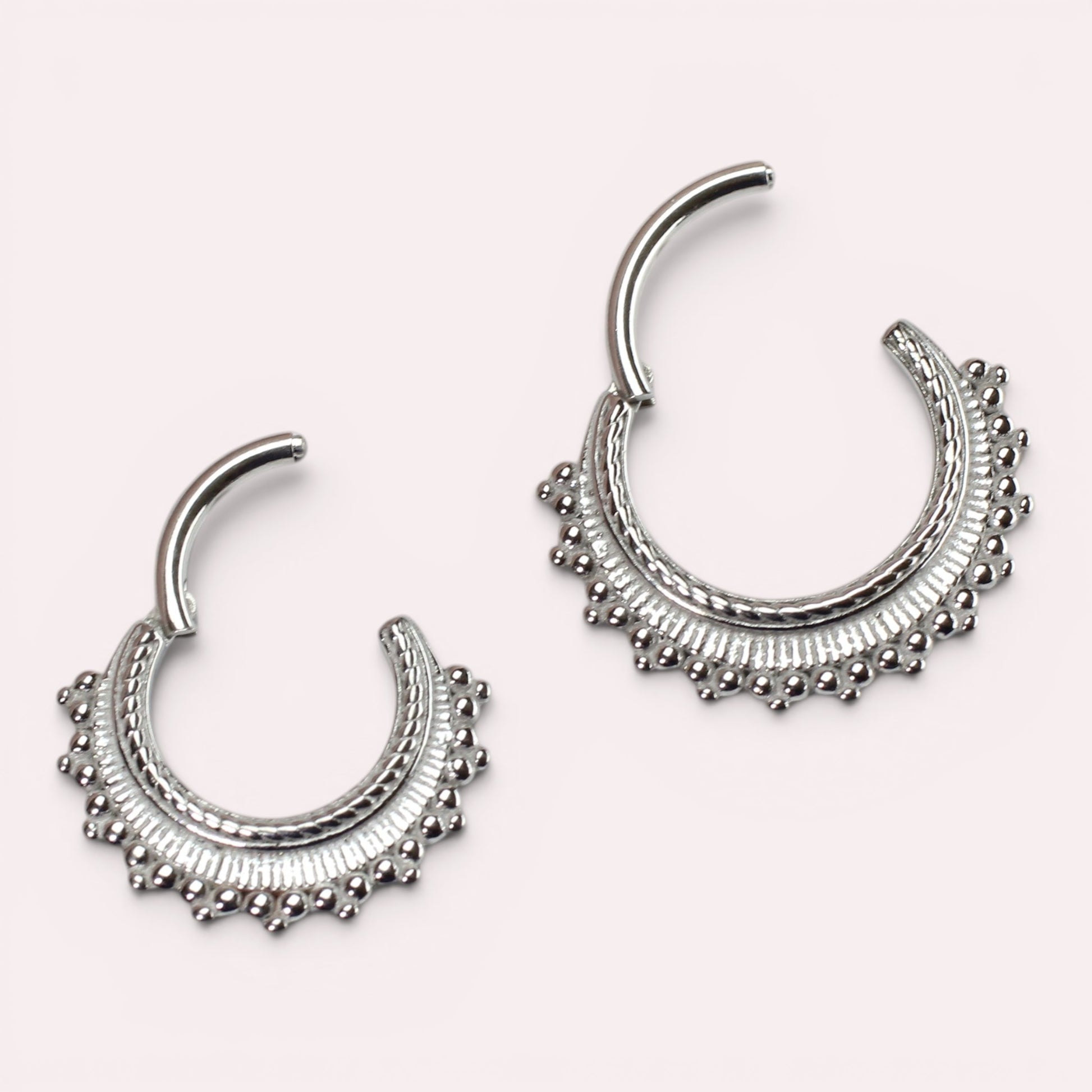 MKBodyJewelry 16g silver beaded tribal style septum clicker ring made of surgical steel with hinged closure.