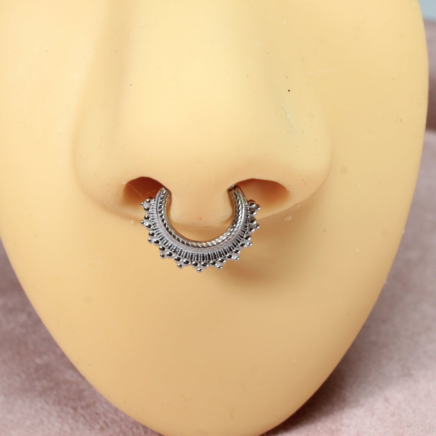 MKBodyJewelry 16g silver beaded tribal style septum clicker ring made of surgical steel. Hinged segment closure.