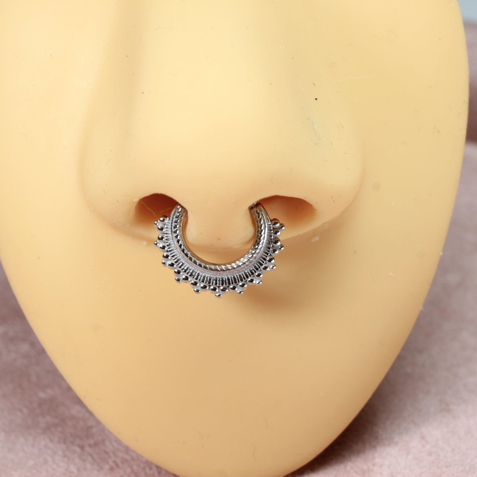 MKBodyJewelry 16g silver beaded tribal style septum clicker ring made of surgical steel. Hinged segment closure.